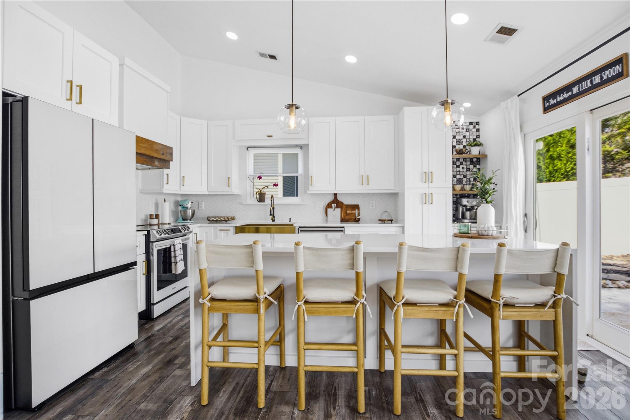 3056 Brookchase Boulevard Fort Mill, SC 29707 - Photo 9 of 23 a kitchen with stainless steel appliances kitchen island granite countertop a refrigerator and microwave