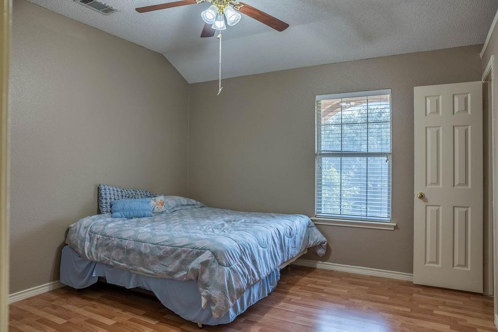 4113 Bluffpoint Road Rowlett, TX 75088 - Photo 25 of 39 a bedroom with a bed and a window