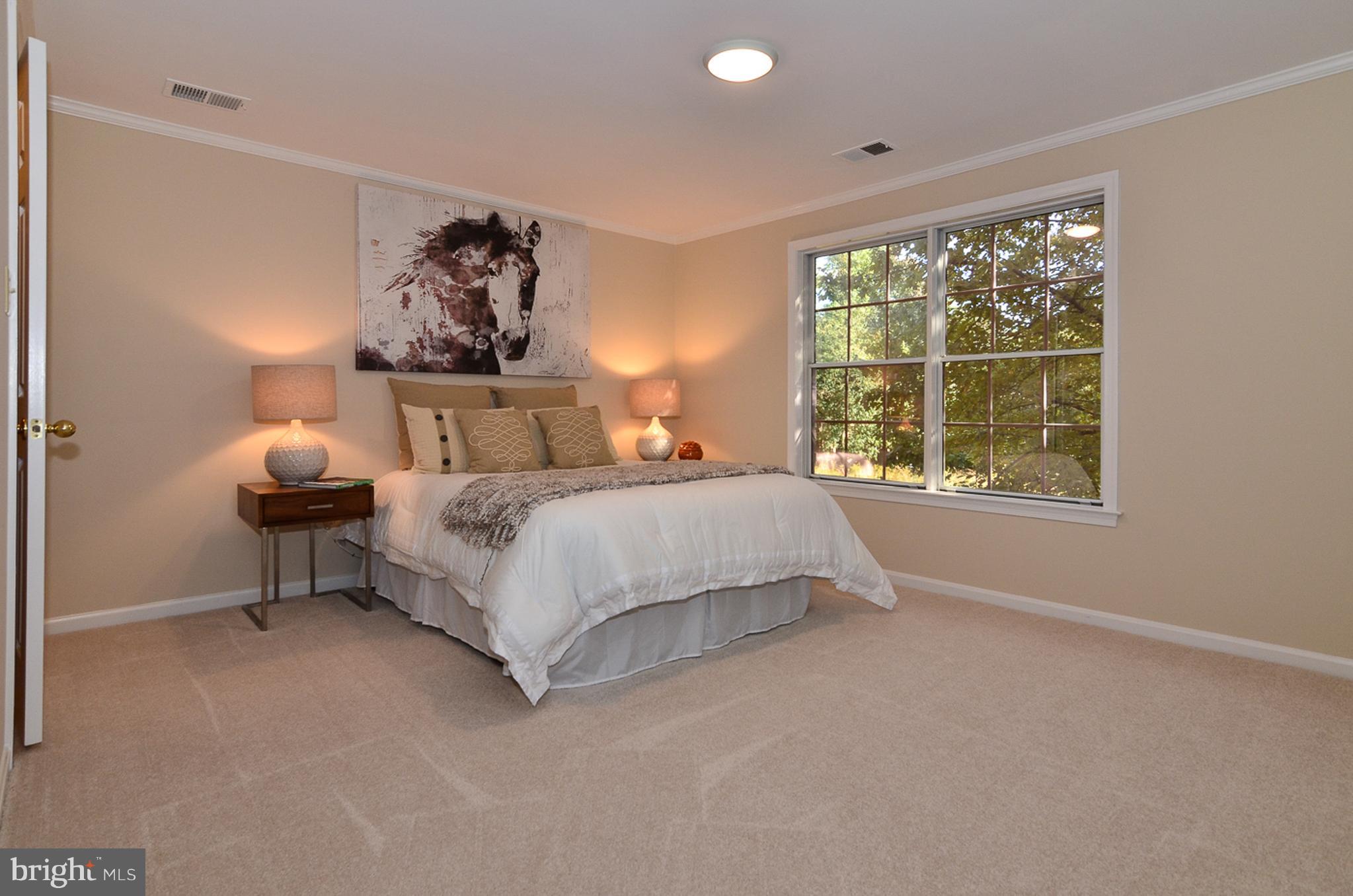 1558 Deer Point Way Reston, VA 20194 - Photo 12 of 22 a bedroom with a bed and a window