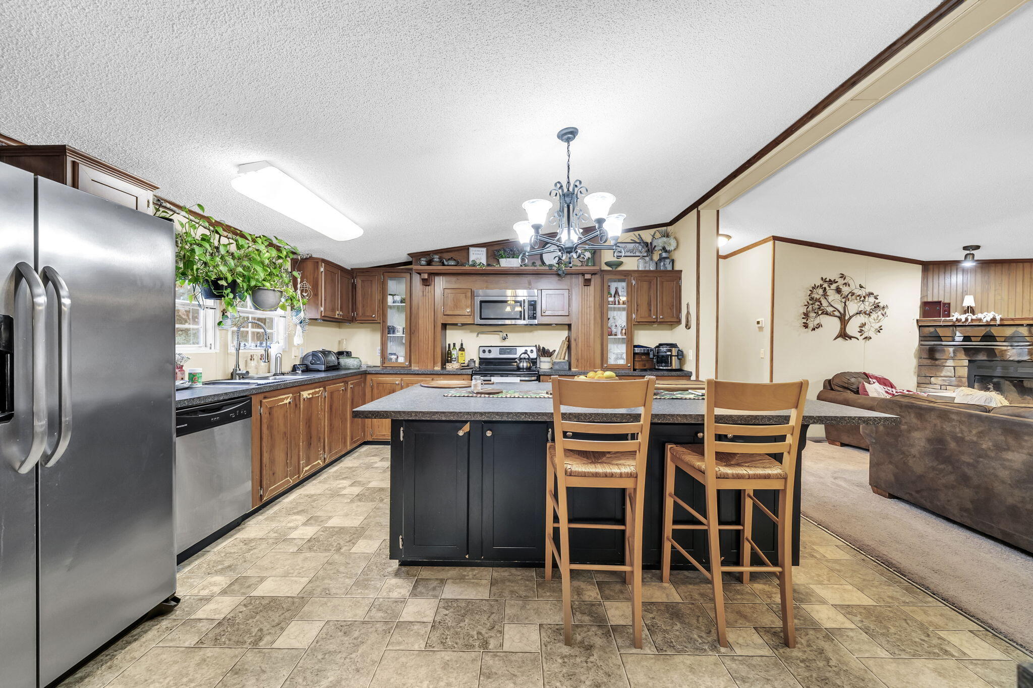 1422 Cat-Mar Road Niceville, FL 32578 - Photo 14 of 35 a kitchen with stainless steel appliances granite countertop a sink a stove and a refrigerator
