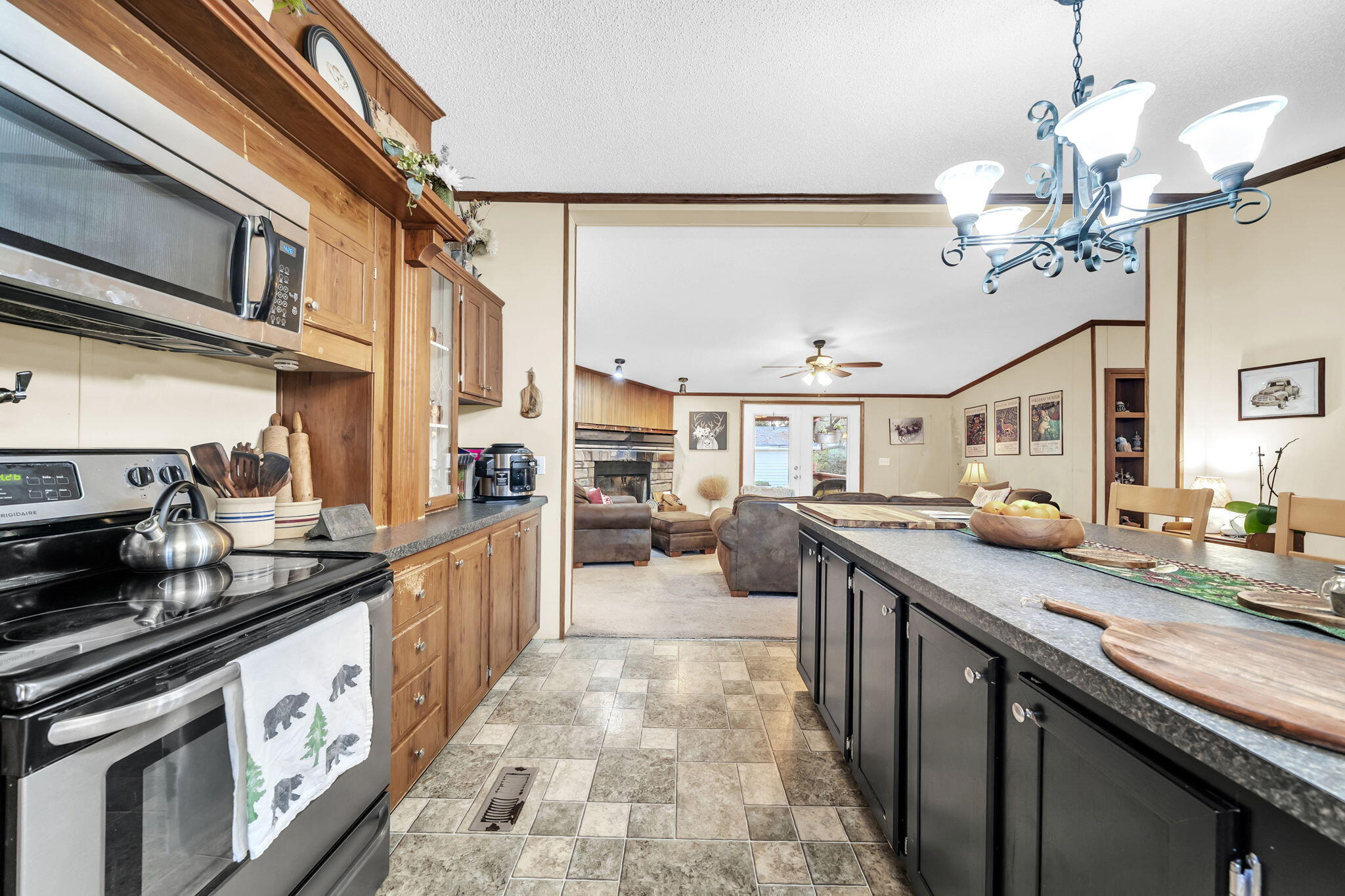 1422 Cat-Mar Road Niceville, FL 32578 - Photo 17 of 35 a kitchen with stainless steel appliances granite countertop a sink and stove