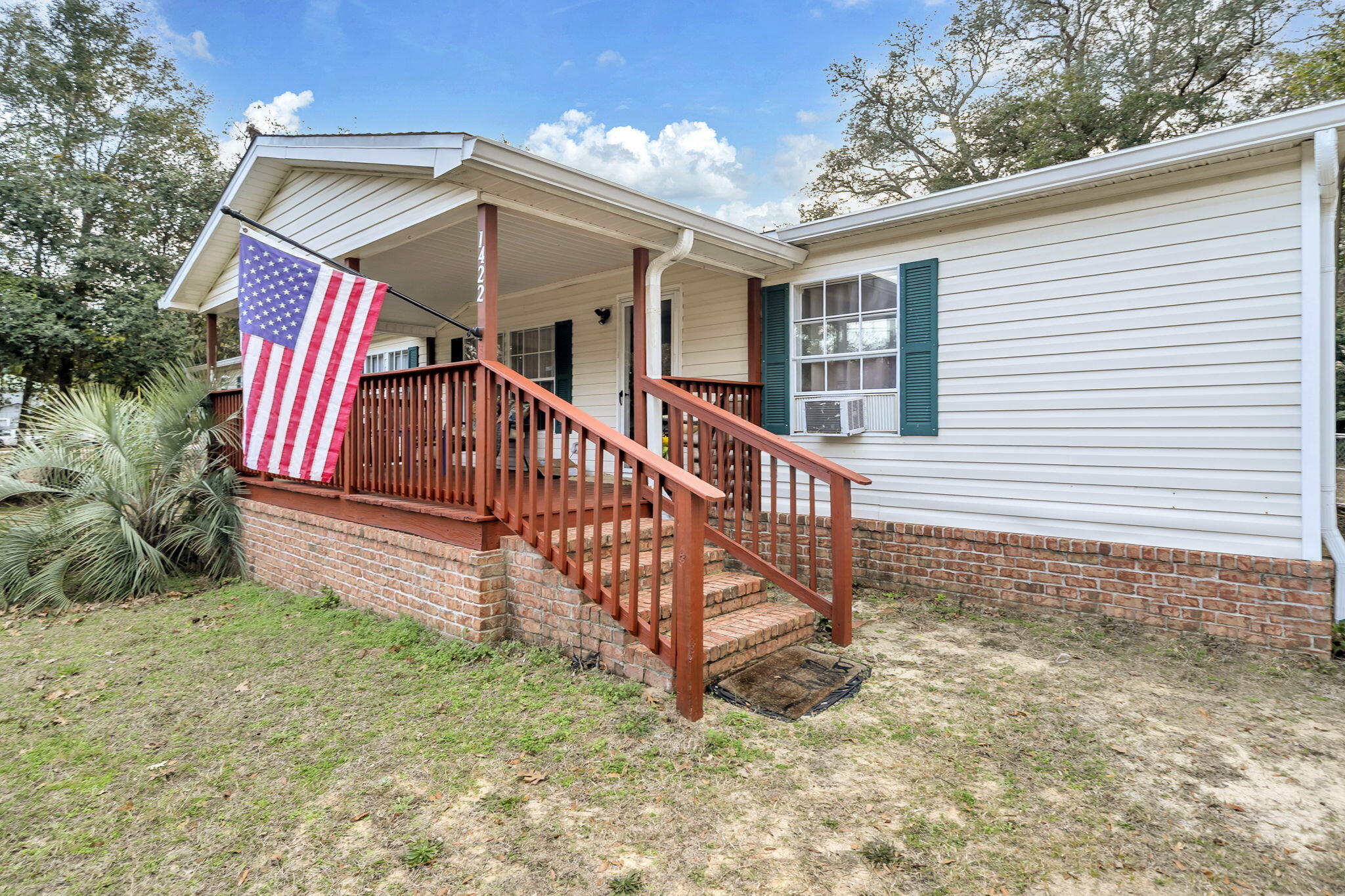 1422 Cat-Mar Road Niceville, FL 32578 - Photo 2 of 35 a view of a house with a yard and wooden fence