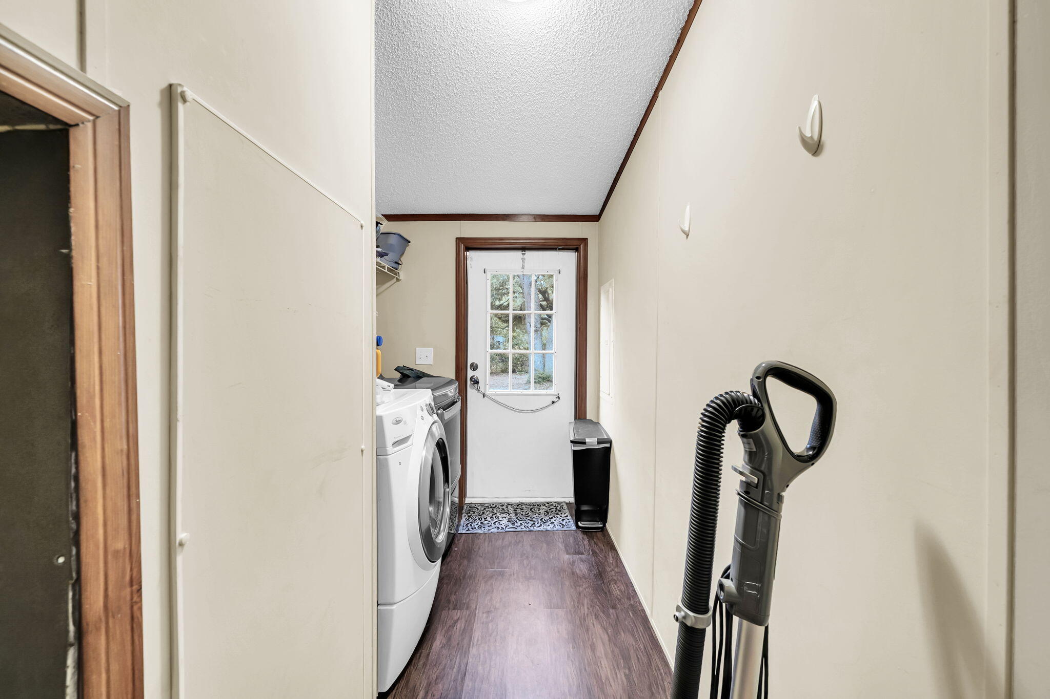 1422 Cat-Mar Road Niceville, FL 32578 - Photo 28 of 35 a view of a hallway with wooden floor and staircase