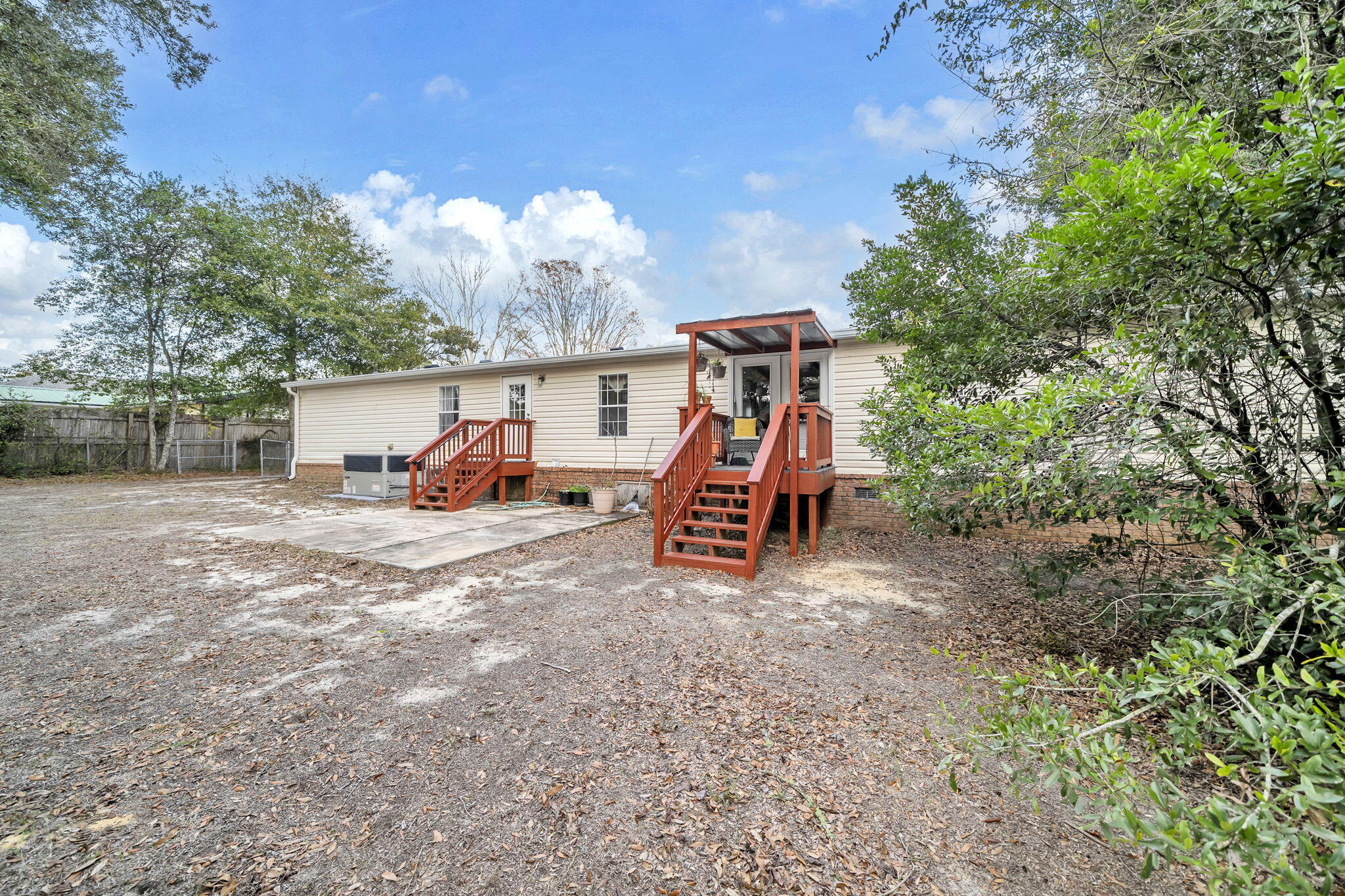 1422 Cat-Mar Road Niceville, FL 32578 - Photo 29 of 35 a view of outdoor space with playground and green space