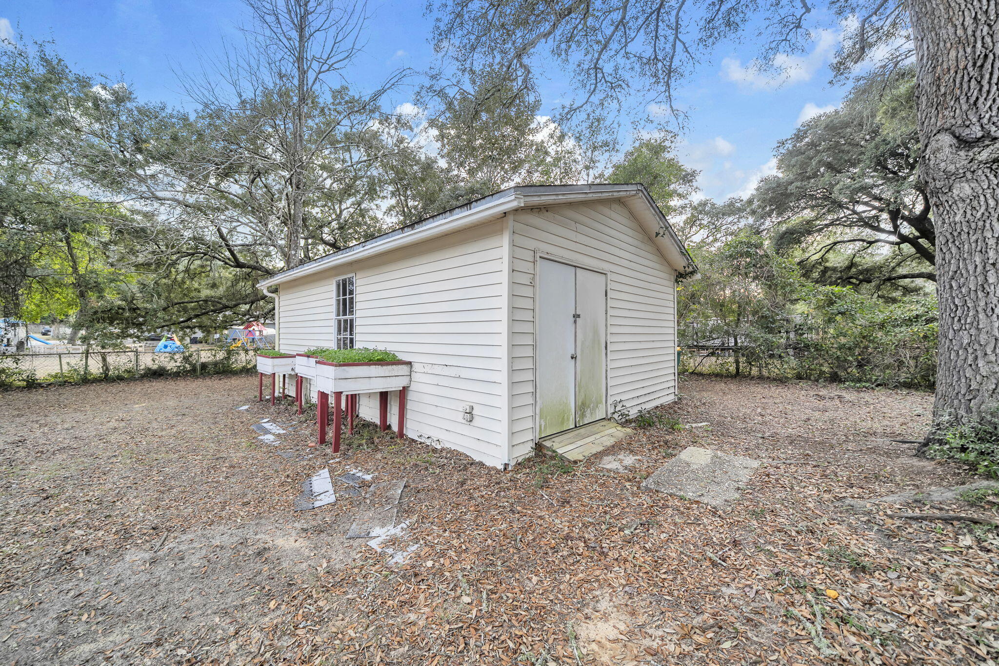1422 Cat-Mar Road Niceville, FL 32578 - Photo 31 of 35 a view of a house with a yard and sitting area