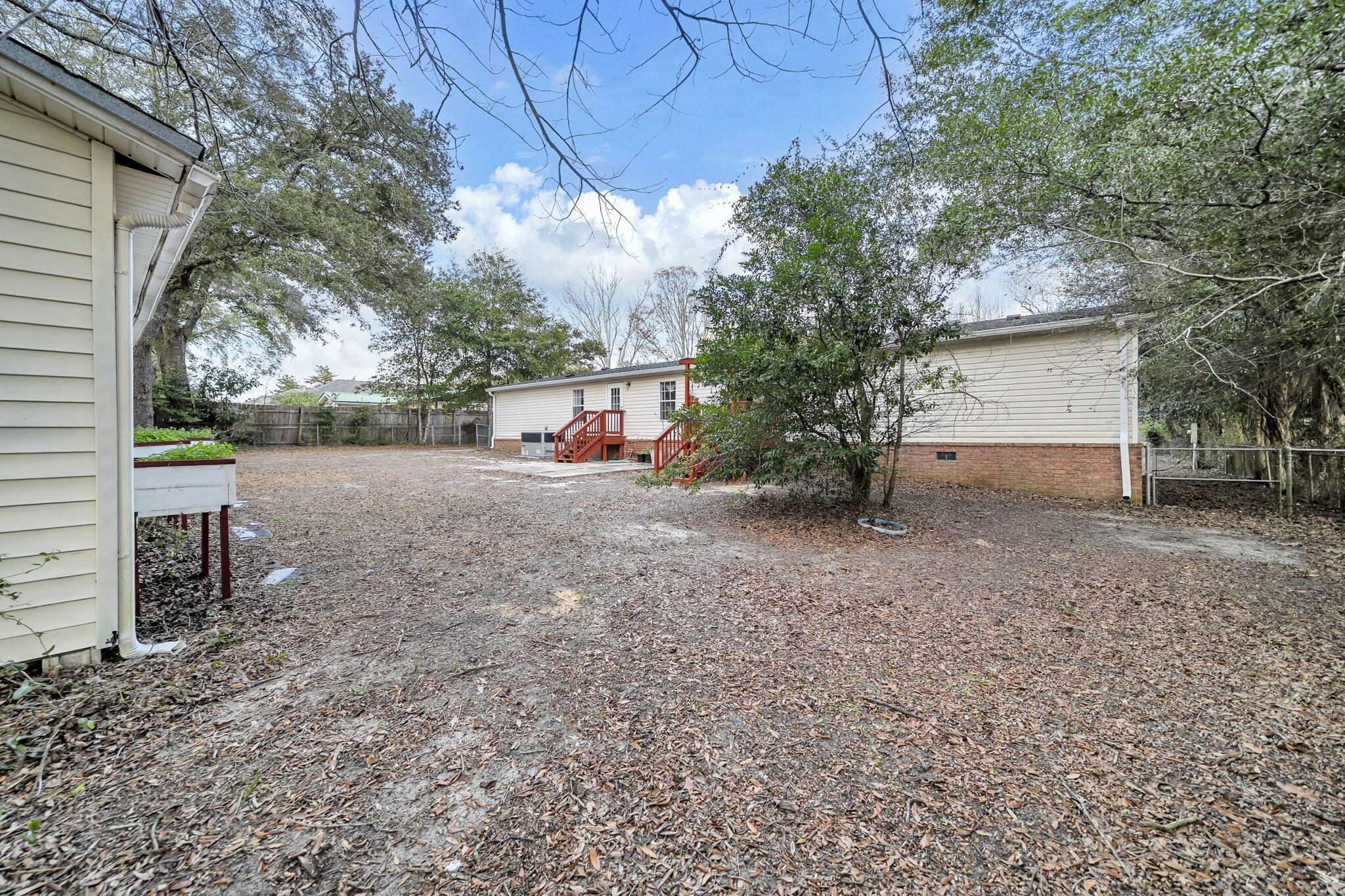1422 Cat-Mar Road Niceville, FL 32578 - Photo 33 of 35 a view of house with backyard and a tree