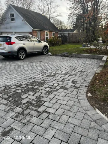 a view of a car parked in a yard
