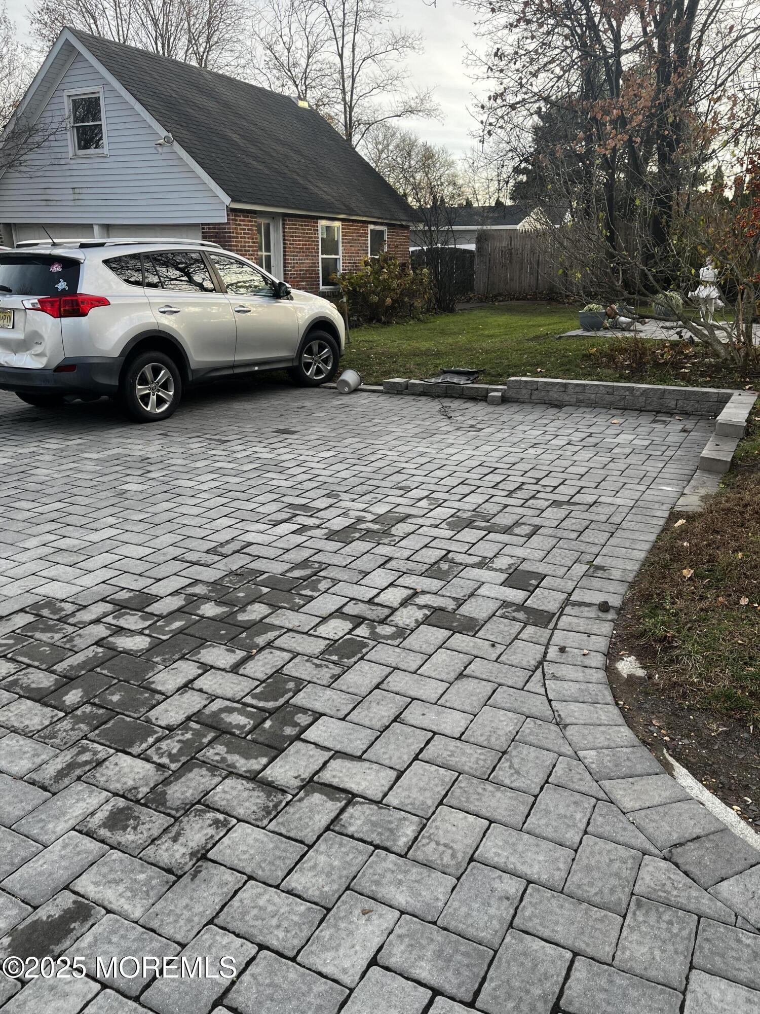 103 Main Street, Unit 1 Matawan, NJ 07747 - Photo 12 of 12 a view of a car parked in a yard
