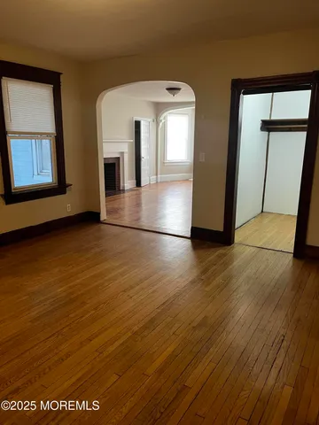 a view of livingroom with hardwood floor and hallway