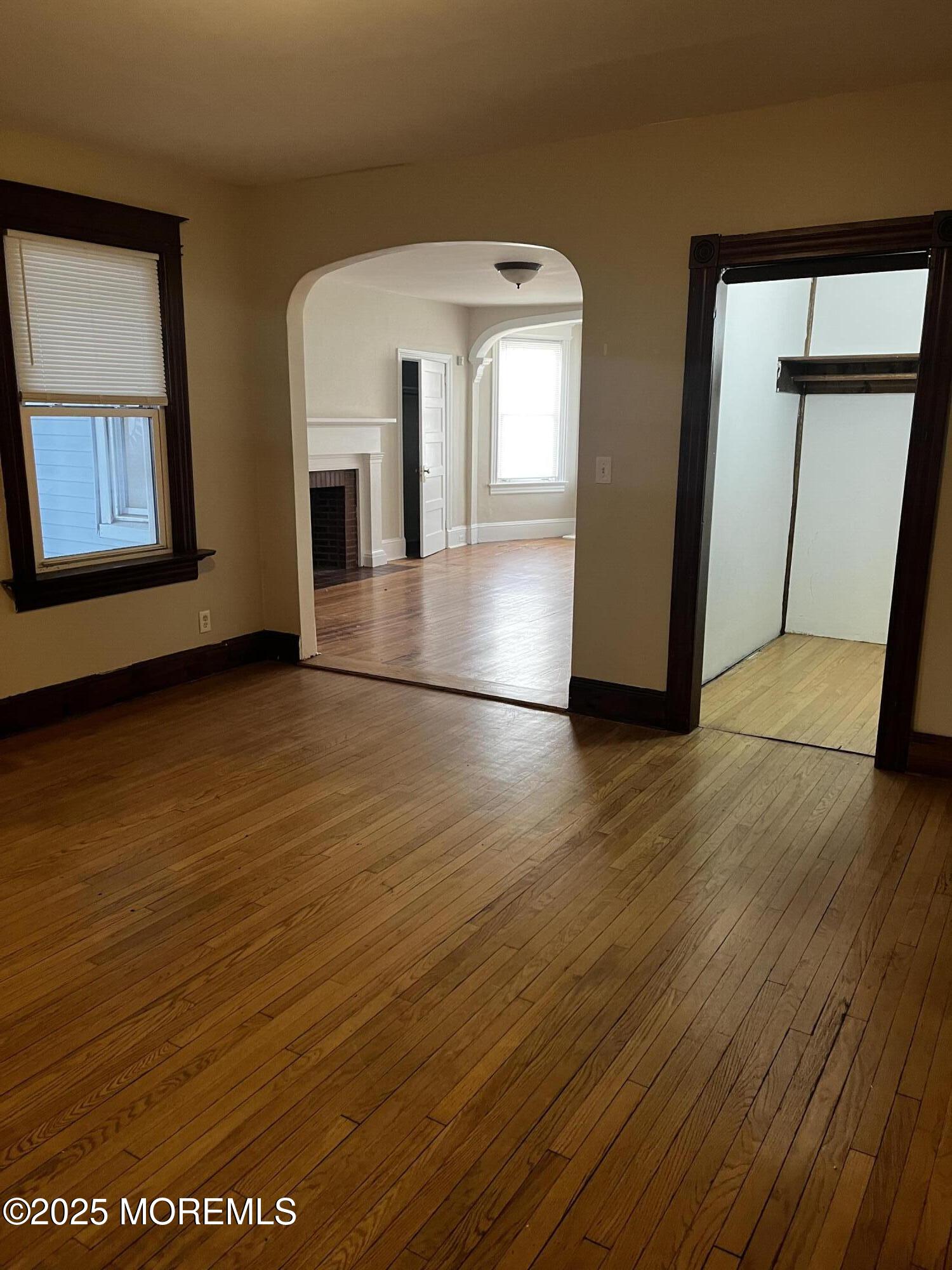 103 Main Street, Unit 1 Matawan, NJ 07747 - Photo 3 of 12 a view of livingroom with hardwood floor and hallway