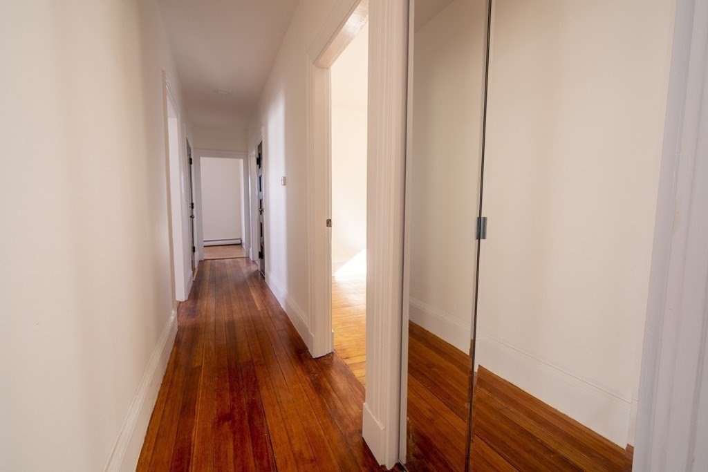 302 Summit Avenue, Unit 1 Boston, MA 02135 - Photo 12 of 13 a view of a hallway with wooden floor