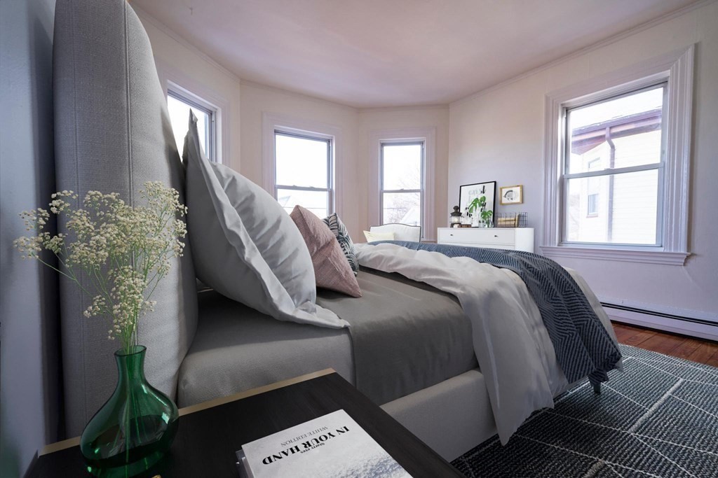 302 Summit Avenue, Unit 1 Boston, MA 02135 - Photo 5 of 13 a bedroom with a bed and window