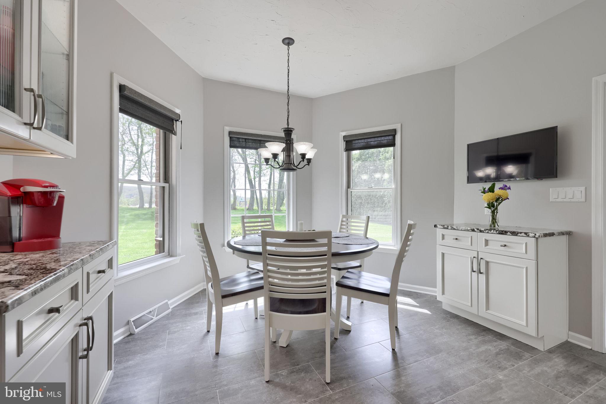2702 Chestnut Run Road York, PA 17402 - Photo 19 of 65 a dining room with furniture a chandelier and window