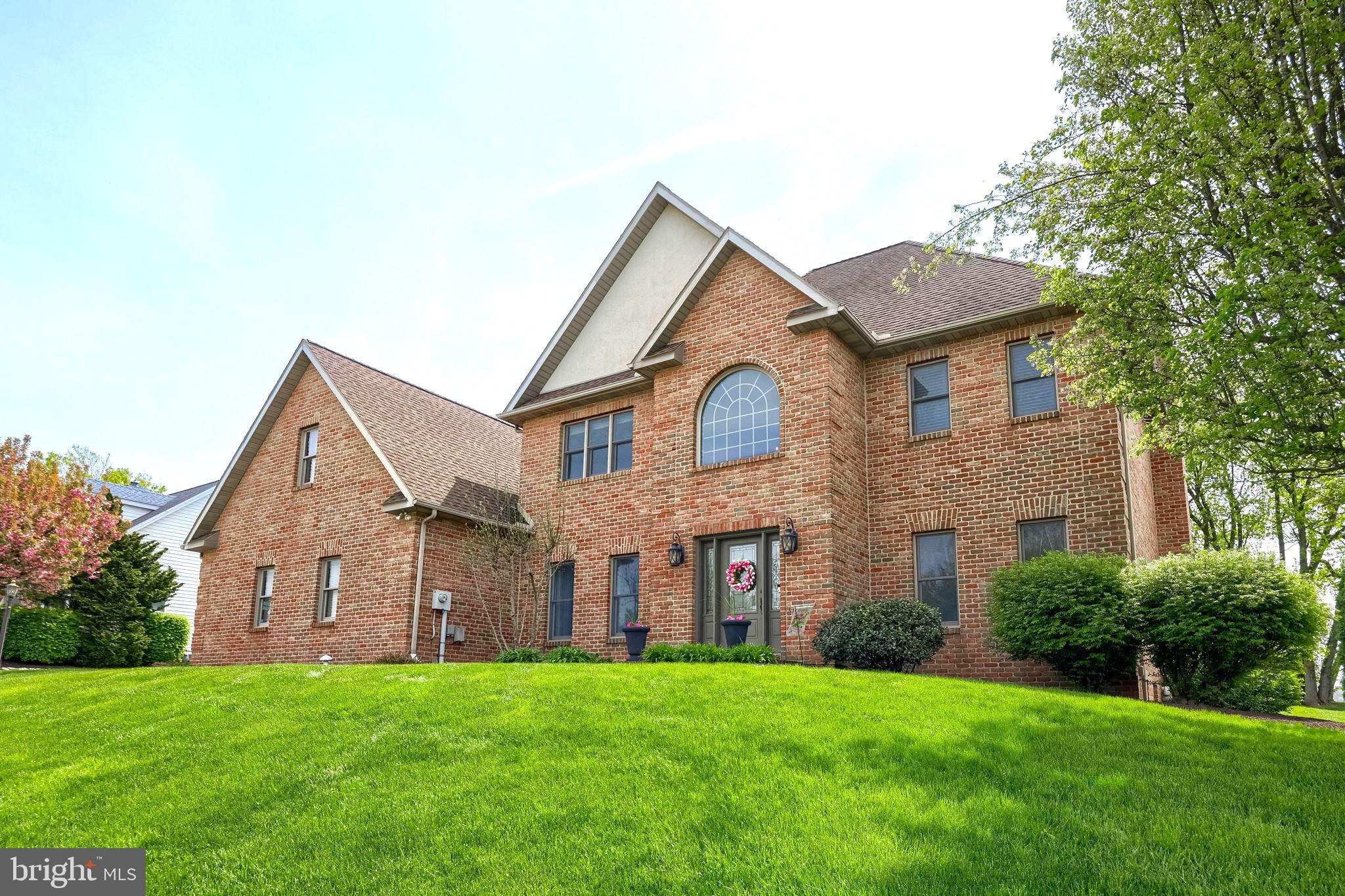 2702 Chestnut Run Road York, PA 17402 - Photo 2 of 65 a front view of a house with a yard and garage