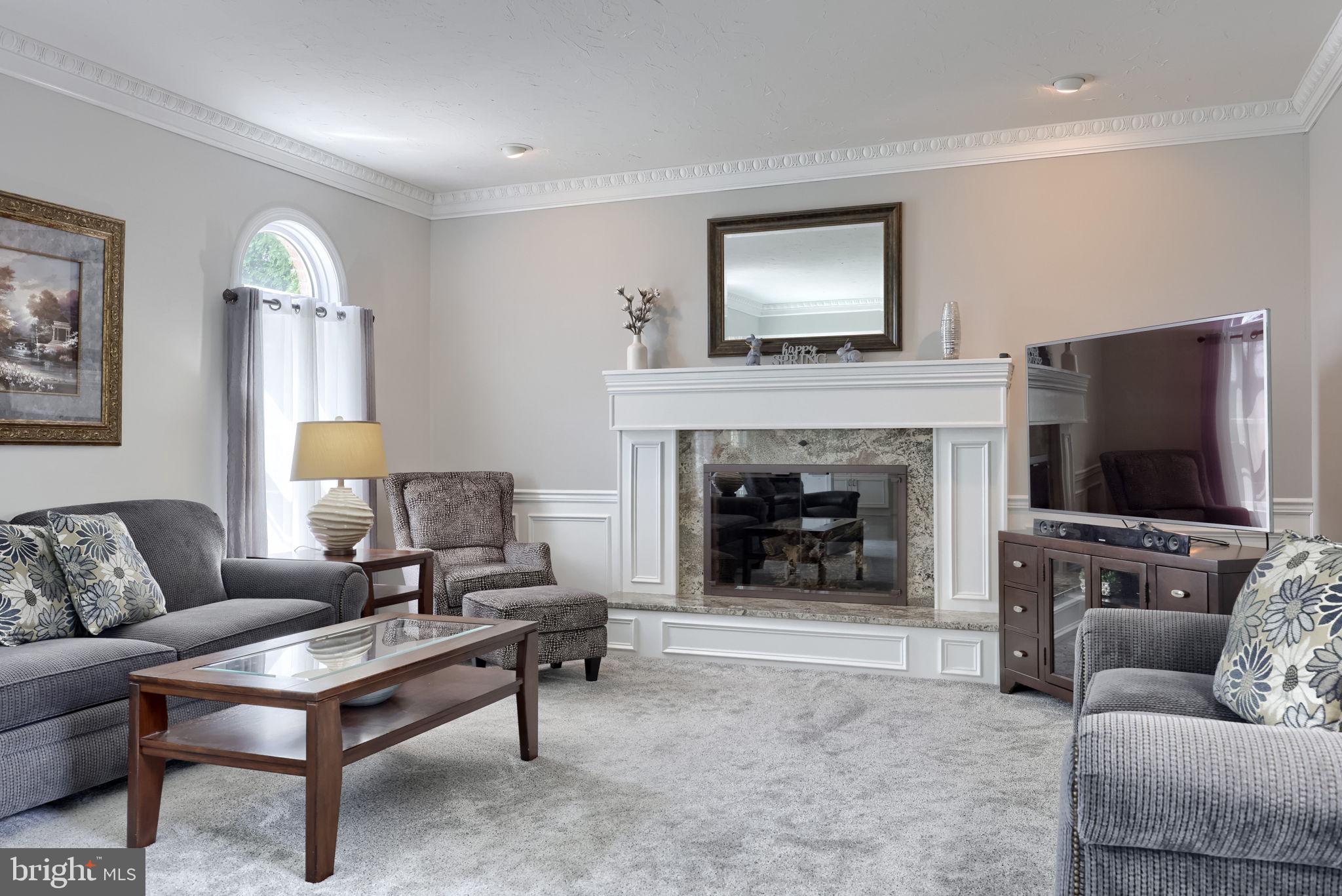 2702 Chestnut Run Road York, PA 17402 - Photo 25 of 65 a living room with furniture and a fireplace