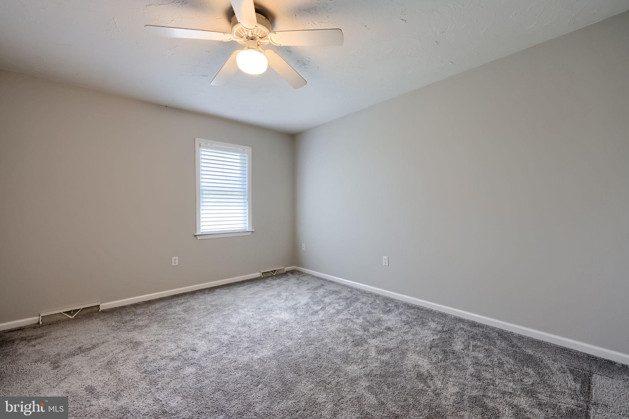 2702 Chestnut Run Road York, PA 17402 - Photo 40 of 65 an empty room with windows and fan
