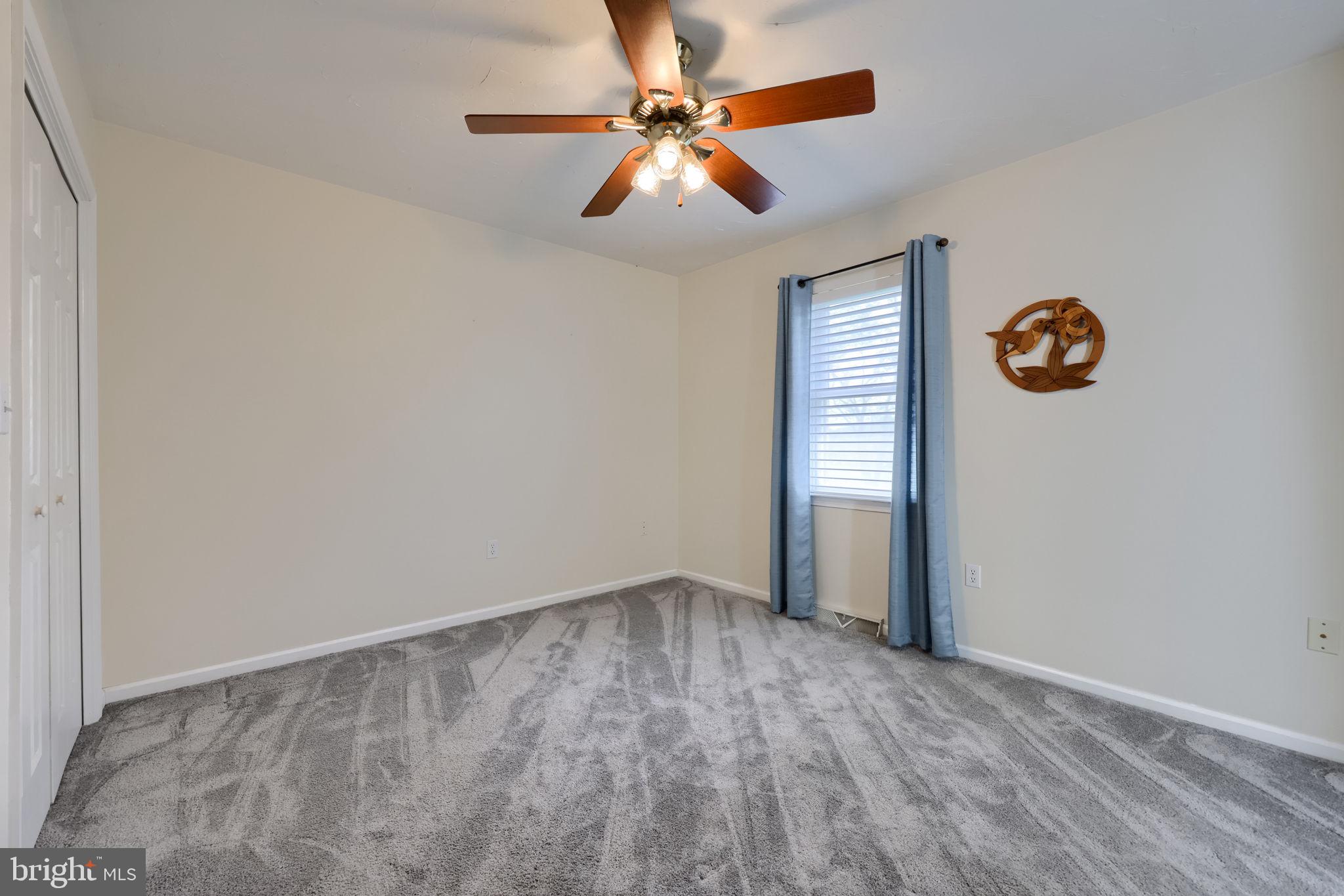 2702 Chestnut Run Road York, PA 17402 - Photo 41 of 65 an empty room with windows and fan