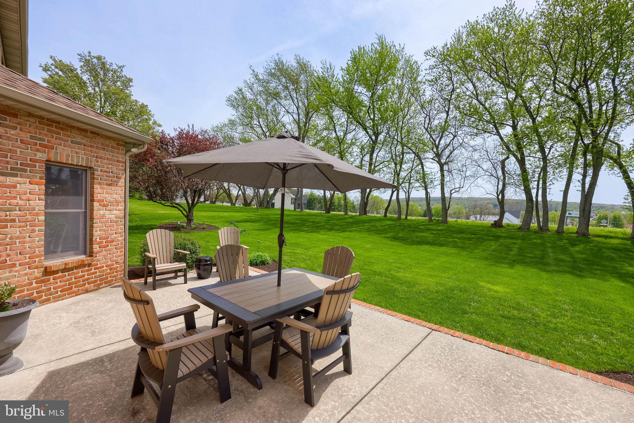 2702 Chestnut Run Road York, PA 17402 - Photo 55 of 65 a view of a table and chairs under an umbrella