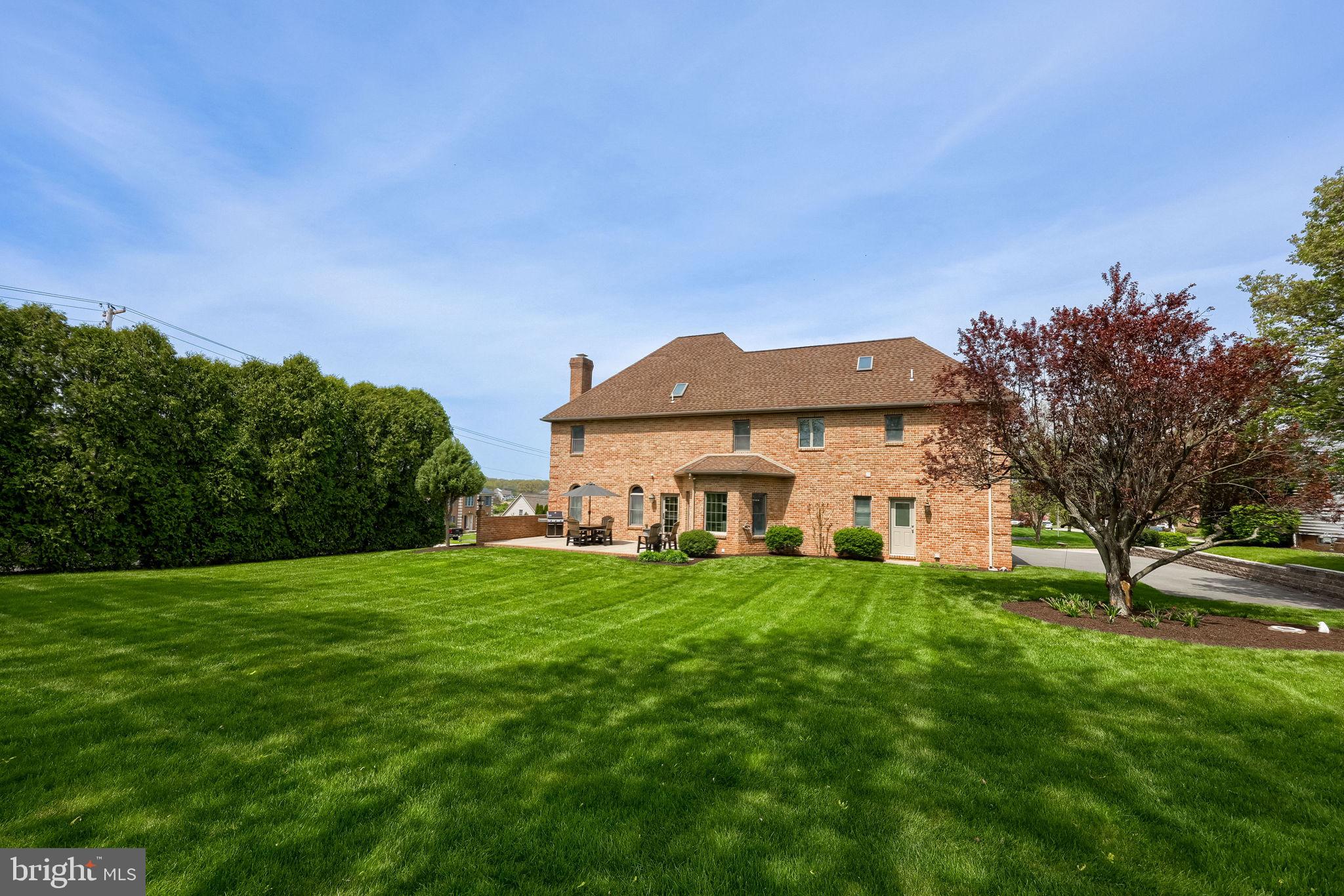 2702 Chestnut Run Road York, PA 17402 - Photo 56 of 65 a view of a big house with a big yard and large trees
