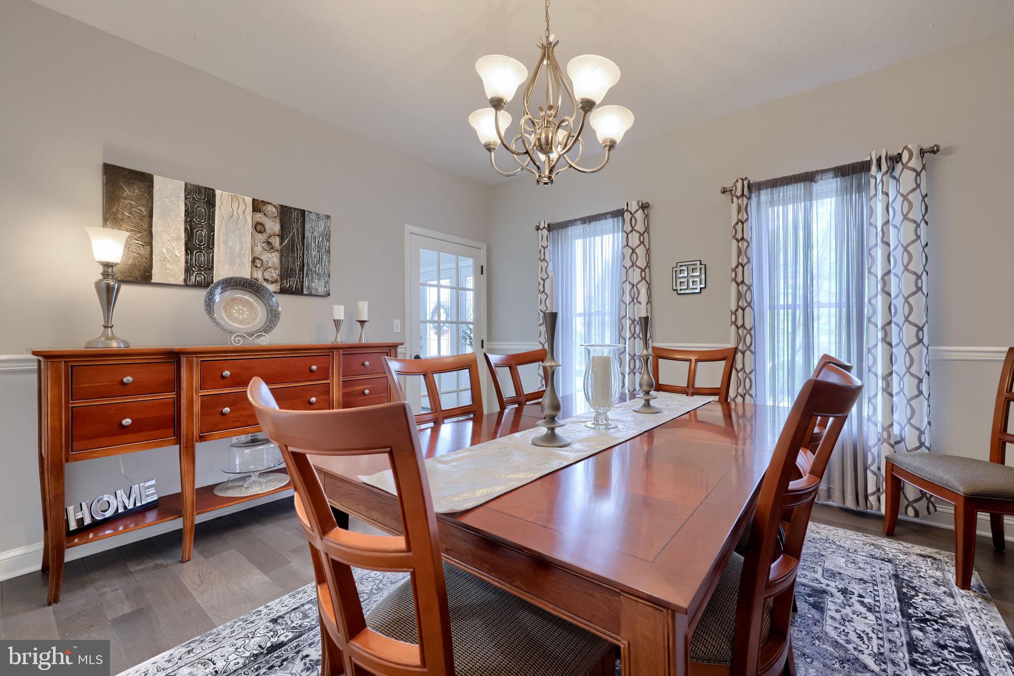 2702 Chestnut Run Road York, PA 17402 - Photo 9 of 65 a view of a dining room with furniture and wooden floor