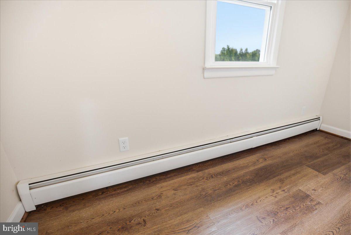 38125 Louis Thomas Road Avenue, MD 20609 - Photo 32 of 73 PRIMARY BEDROOM NEW LVP FLOORING 2026 YR