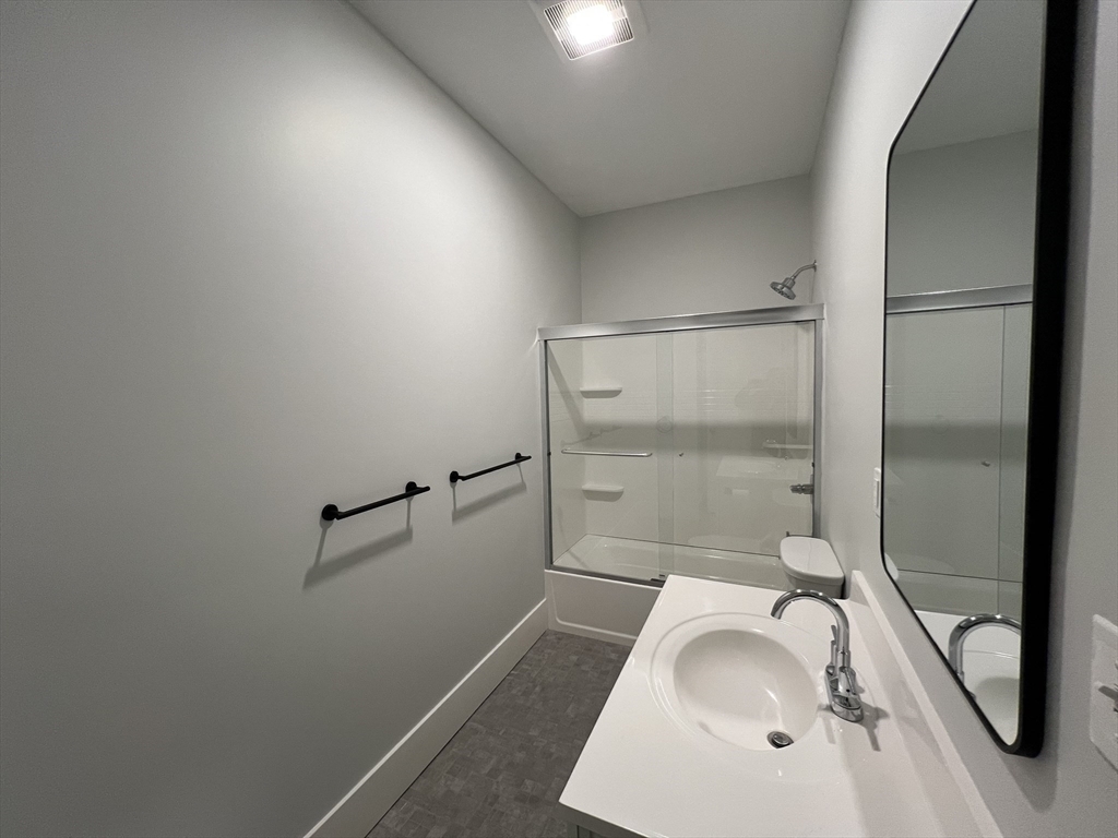 34 St Joseph Street, Unit 23 Fall River, MA 02723 - Photo 12 of 19 a bathroom with a tub sink and shower