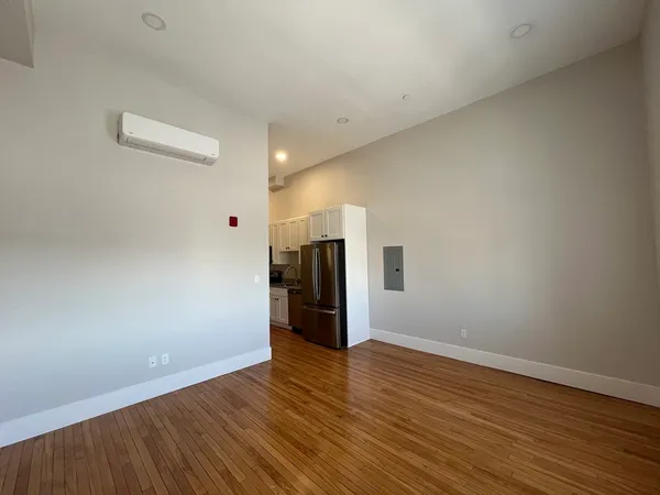 a view of a storage & utility room with wooden floor