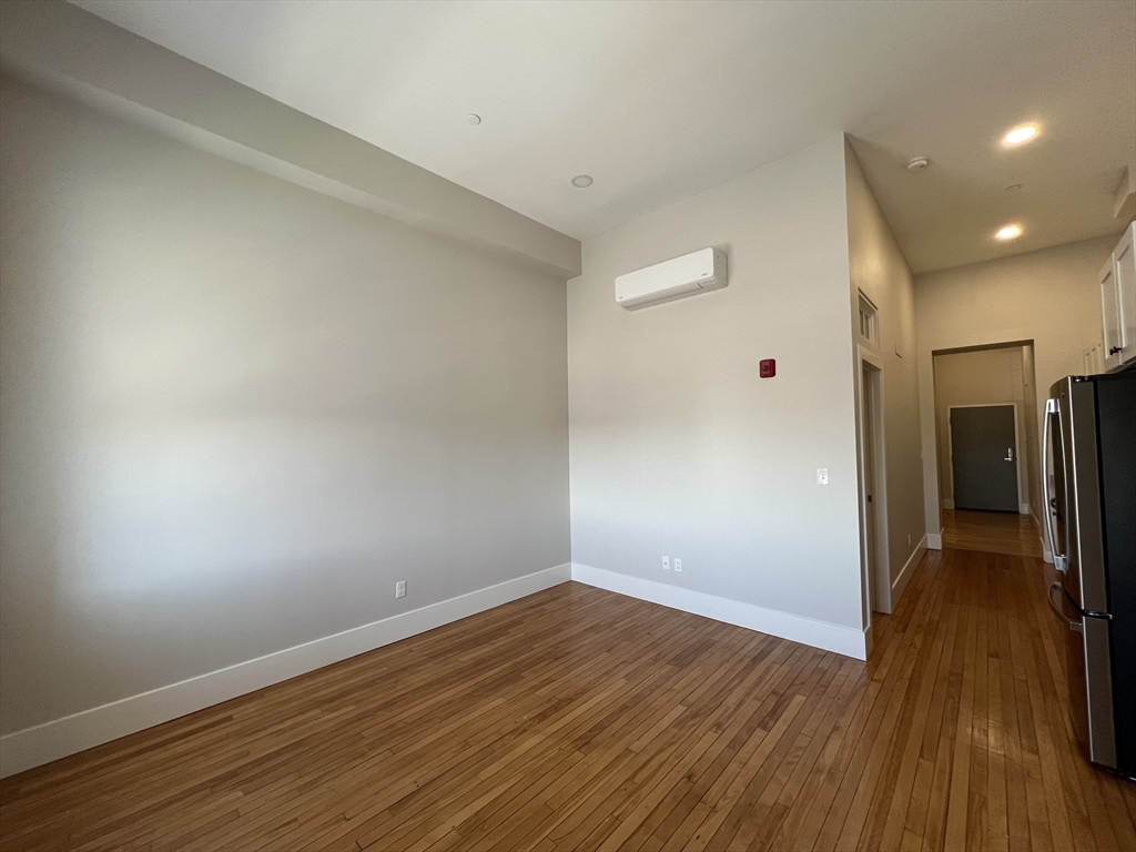34 St Joseph Street, Unit 23 Fall River, MA 02723 - Photo 7 of 19 a view of a hallway with wooden floor
