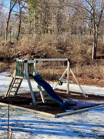 a view of a backyard with a fence