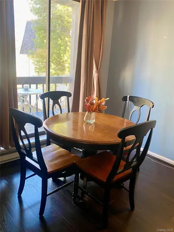 a view of a dining room with furniture and window