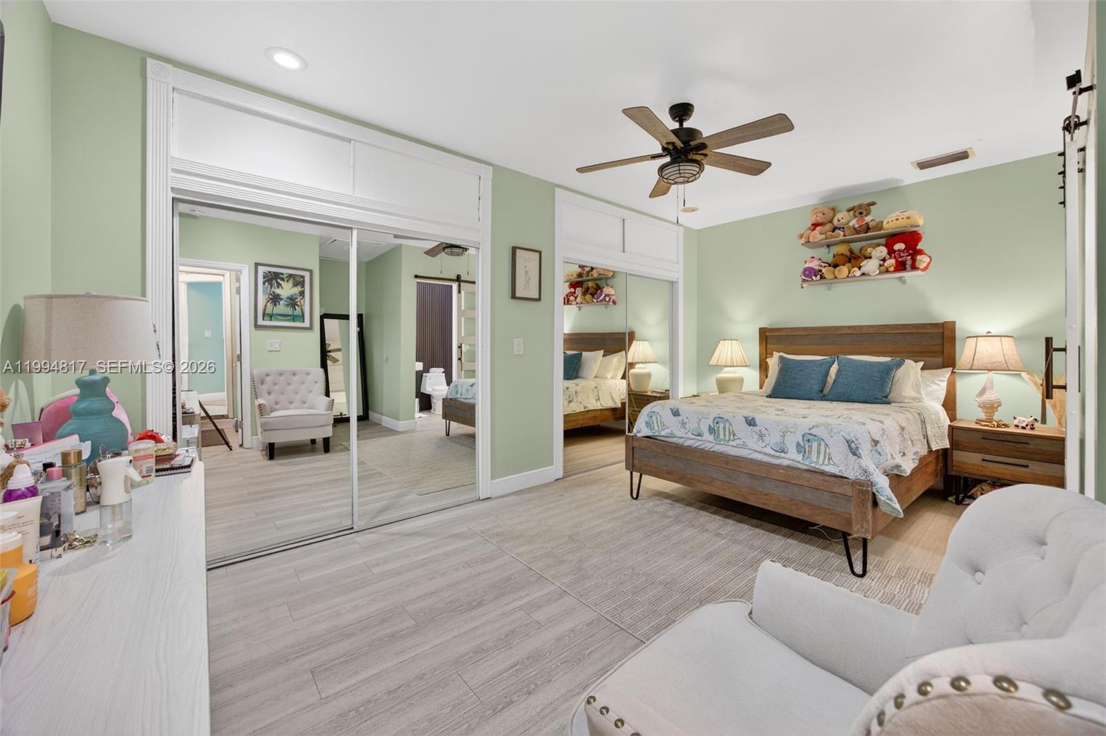 14610 Southwest 145th Place Miami, FL 33186 - Photo 13 of 52 a bedroom with a bed and window