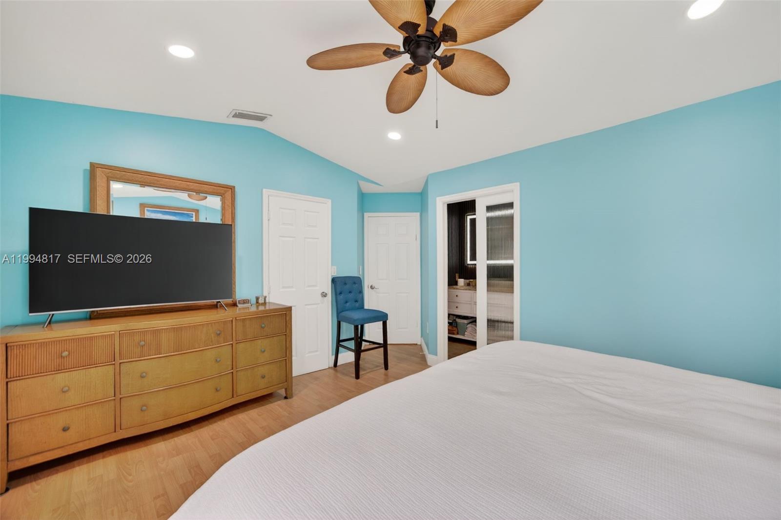 14610 Southwest 145th Place Miami, FL 33186 - Photo 18 of 52 a bedroom with a bed and a dresser