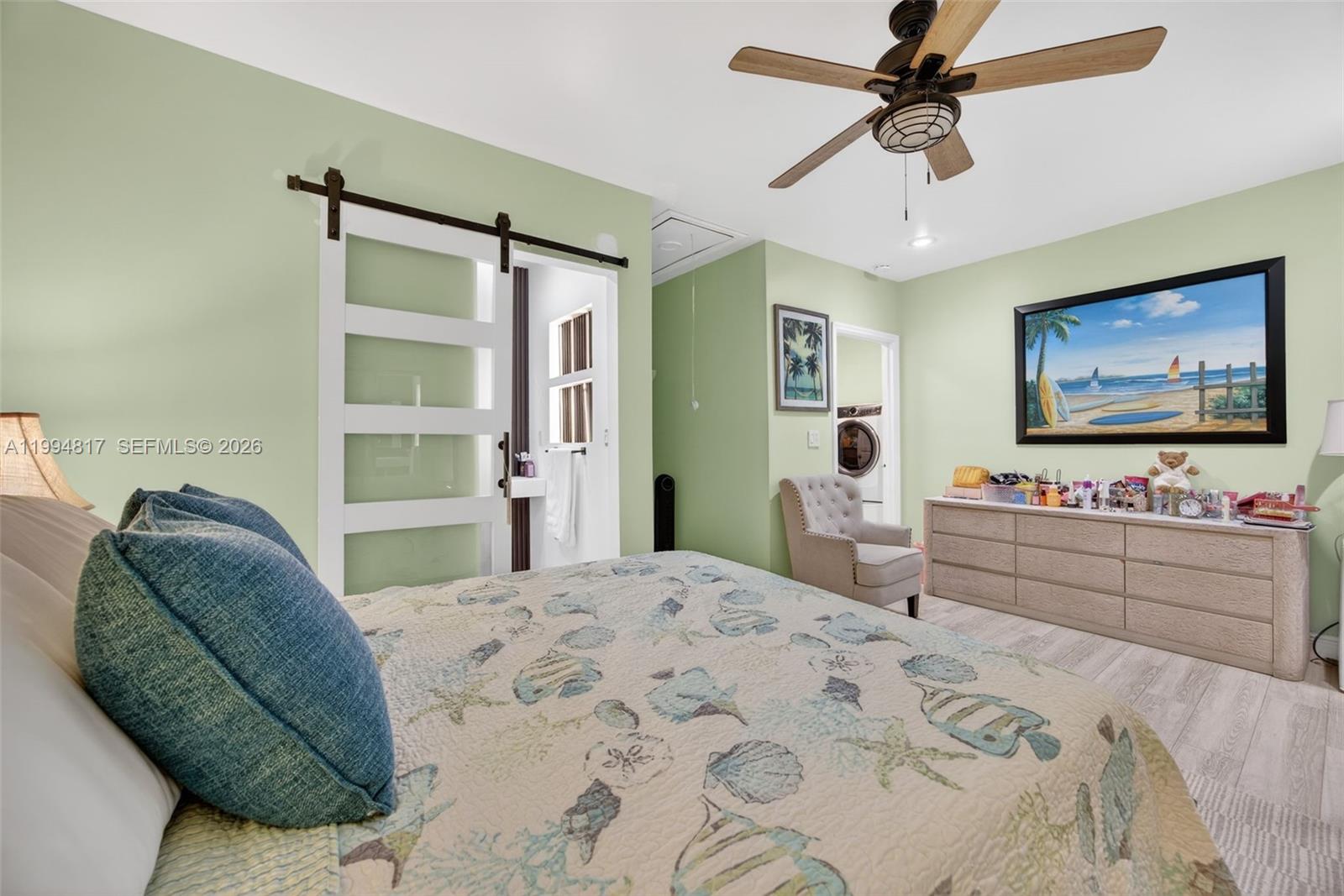 14610 Southwest 145th Place Miami, FL 33186 - Photo 30 of 52 a bedroom with a bed and a flat screen tv