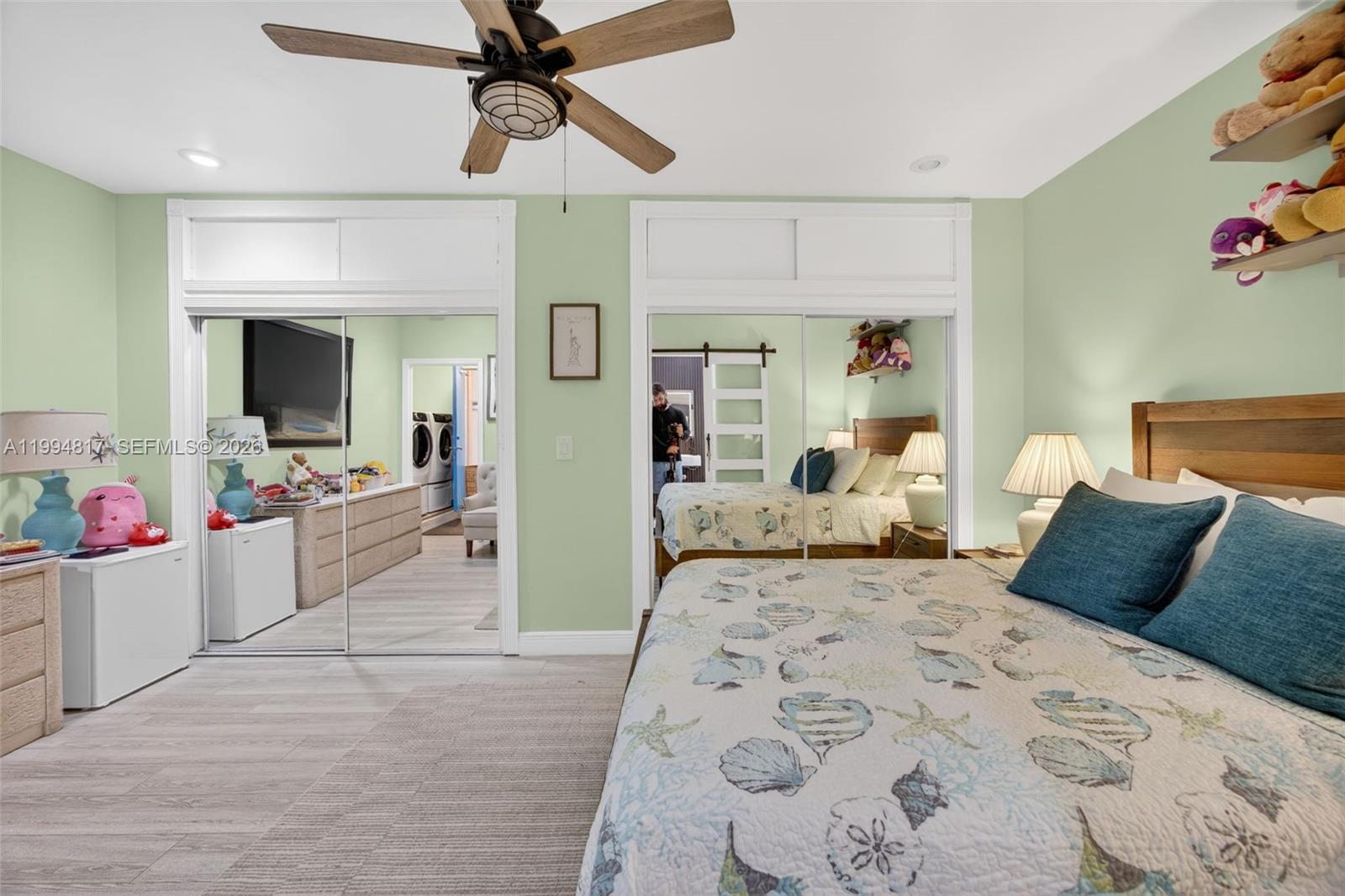 14610 Southwest 145th Place Miami, FL 33186 - Photo 31 of 52 a bedroom with a bed and ceiling fan