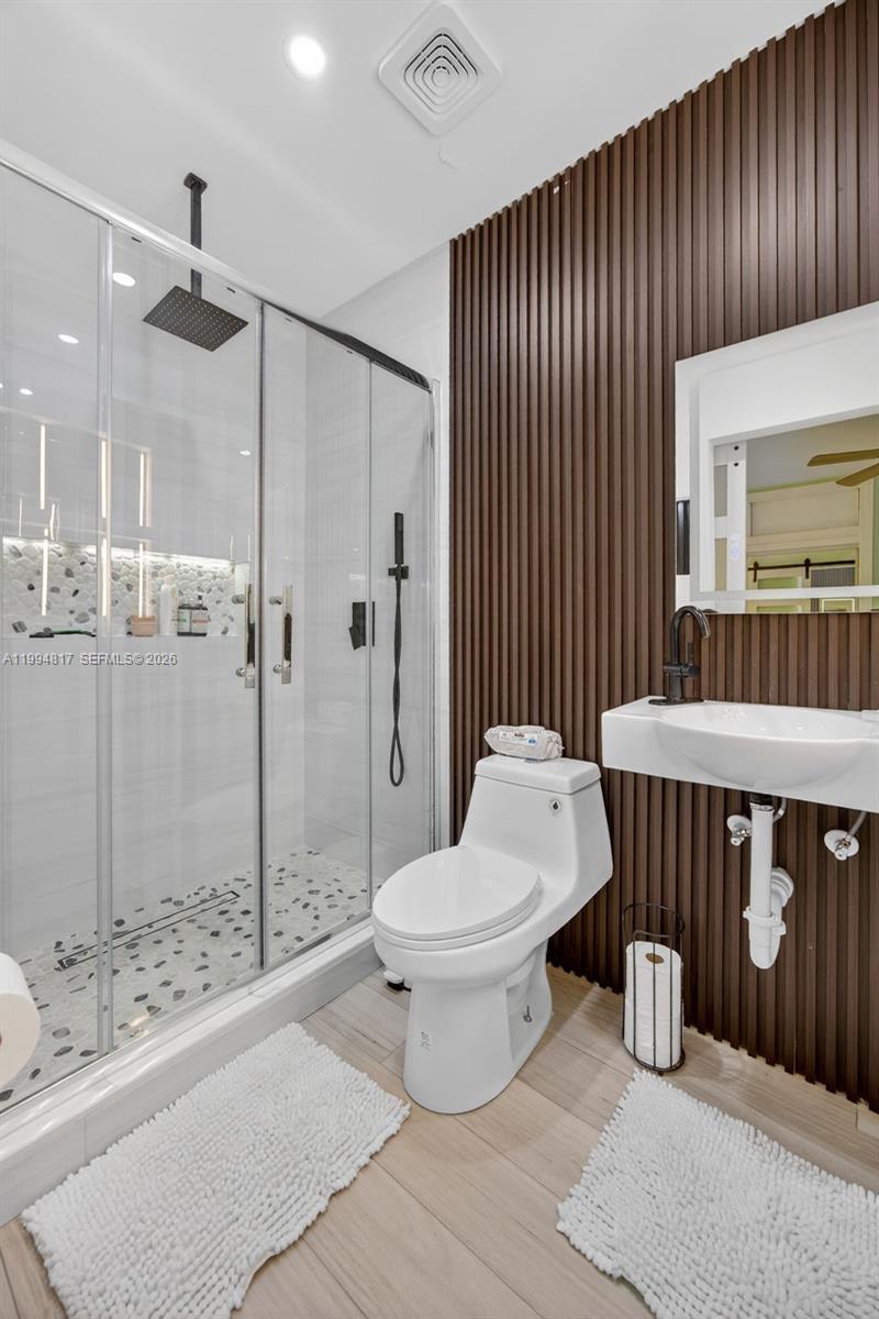 14610 Southwest 145th Place Miami, FL 33186 - Photo 33 of 52 a bathroom with a sink toilet and shower