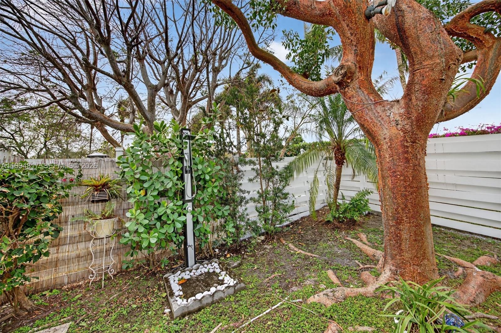 14610 Southwest 145th Place Miami, FL 33186 - Photo 37 of 52 a backyard of a house with lots of green space