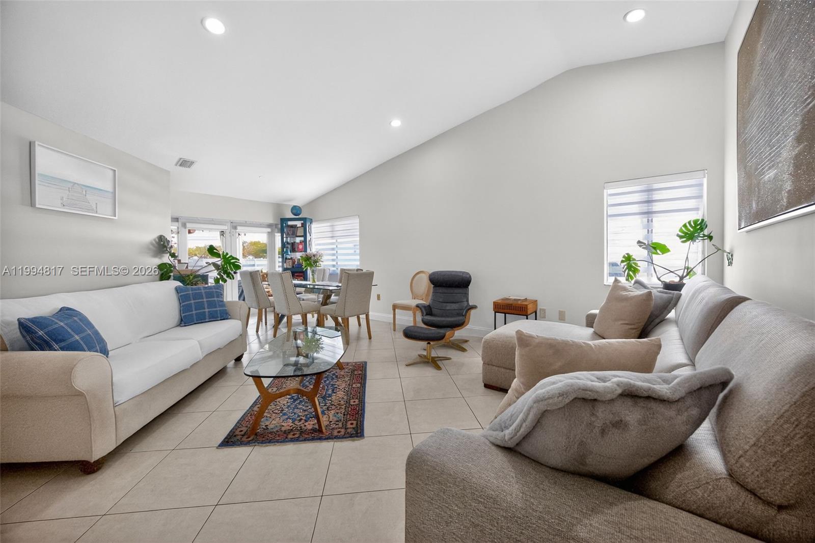 14610 Southwest 145th Place Miami, FL 33186 - Photo 5 of 52 a living room with furniture and a potted plant