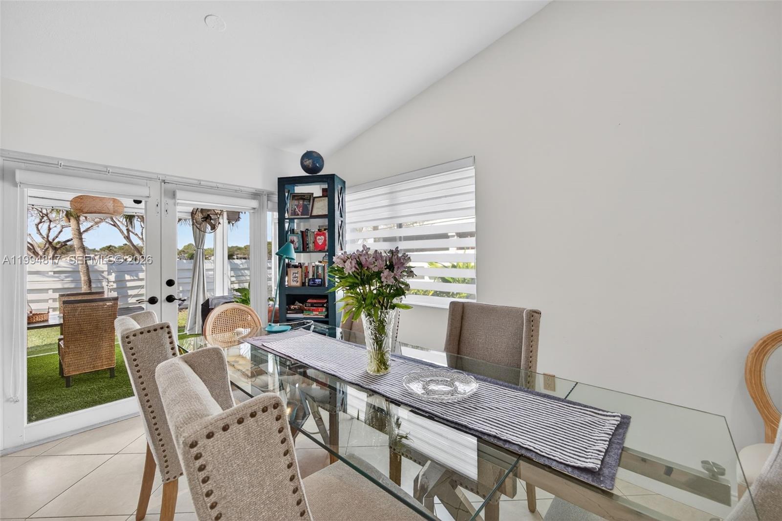 14610 Southwest 145th Place Miami, FL 33186 - Photo 9 of 52 a dining room with furniture and window