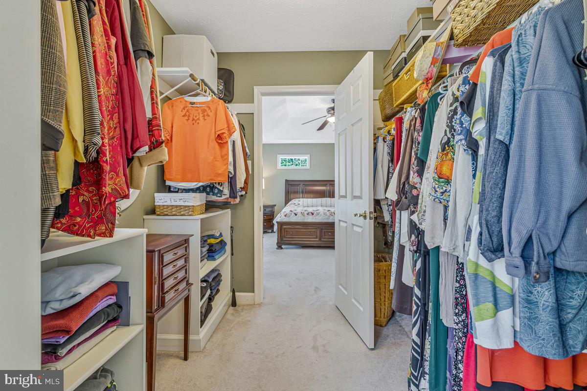11565 Magnolia Court Issue, MD 20645 - Photo 31 of 68 a view of walk in closet with clothes and shoes