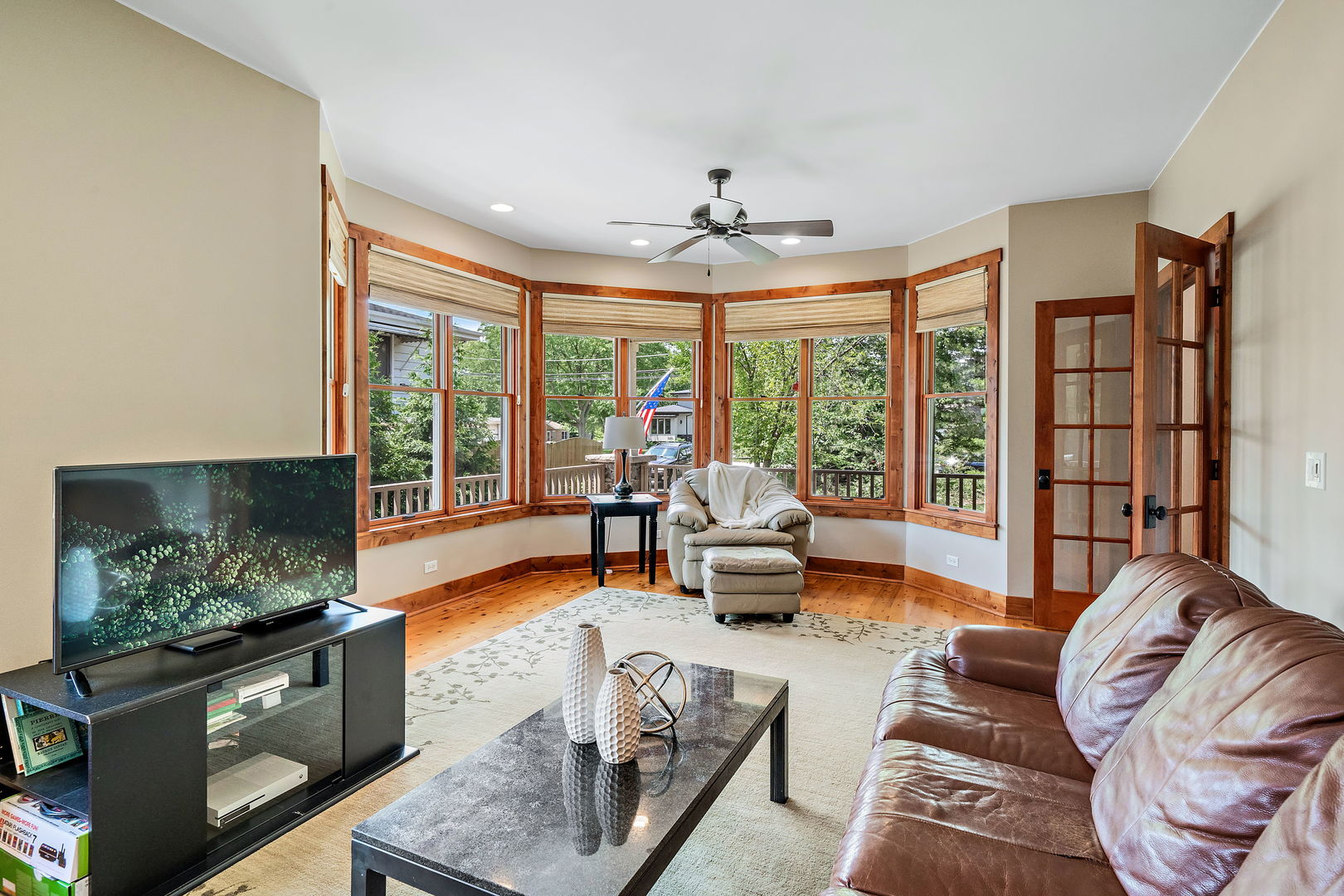 4511 Cumnor Road Downers Grove, IL 60515 - Photo 20 of 42 a living room with furniture and a flat screen tv