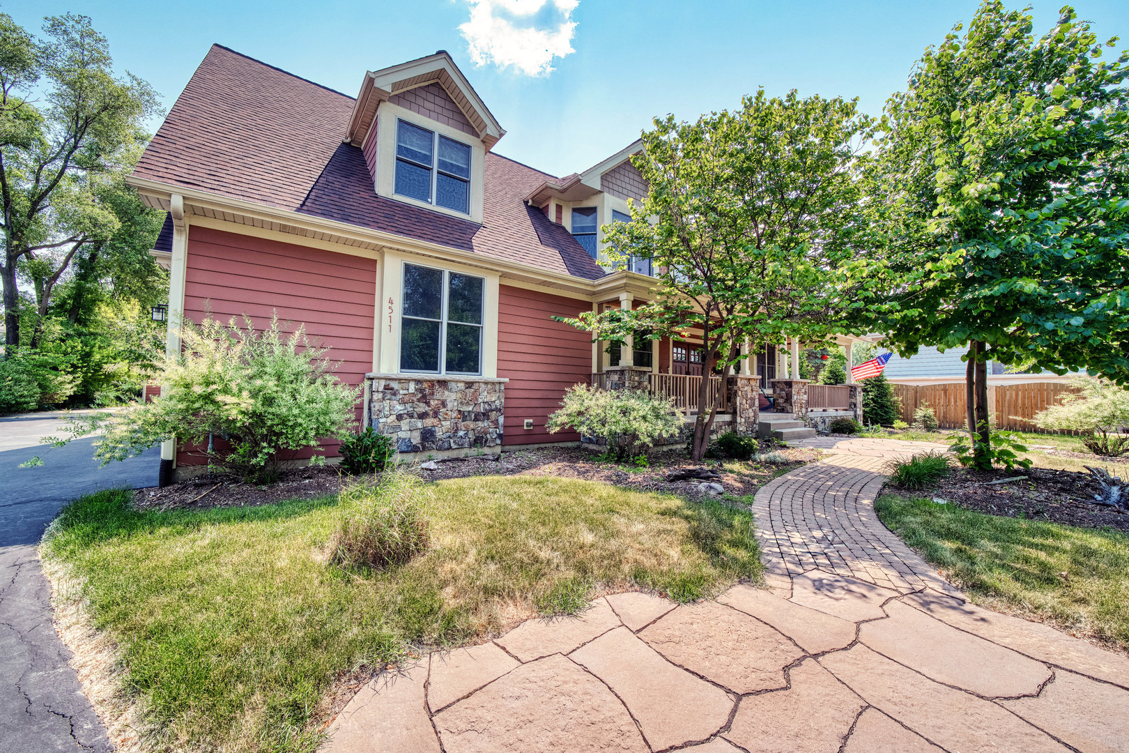 4511 Cumnor Road Downers Grove, IL 60515 - Photo 2 of 42 a front view of a house with garden