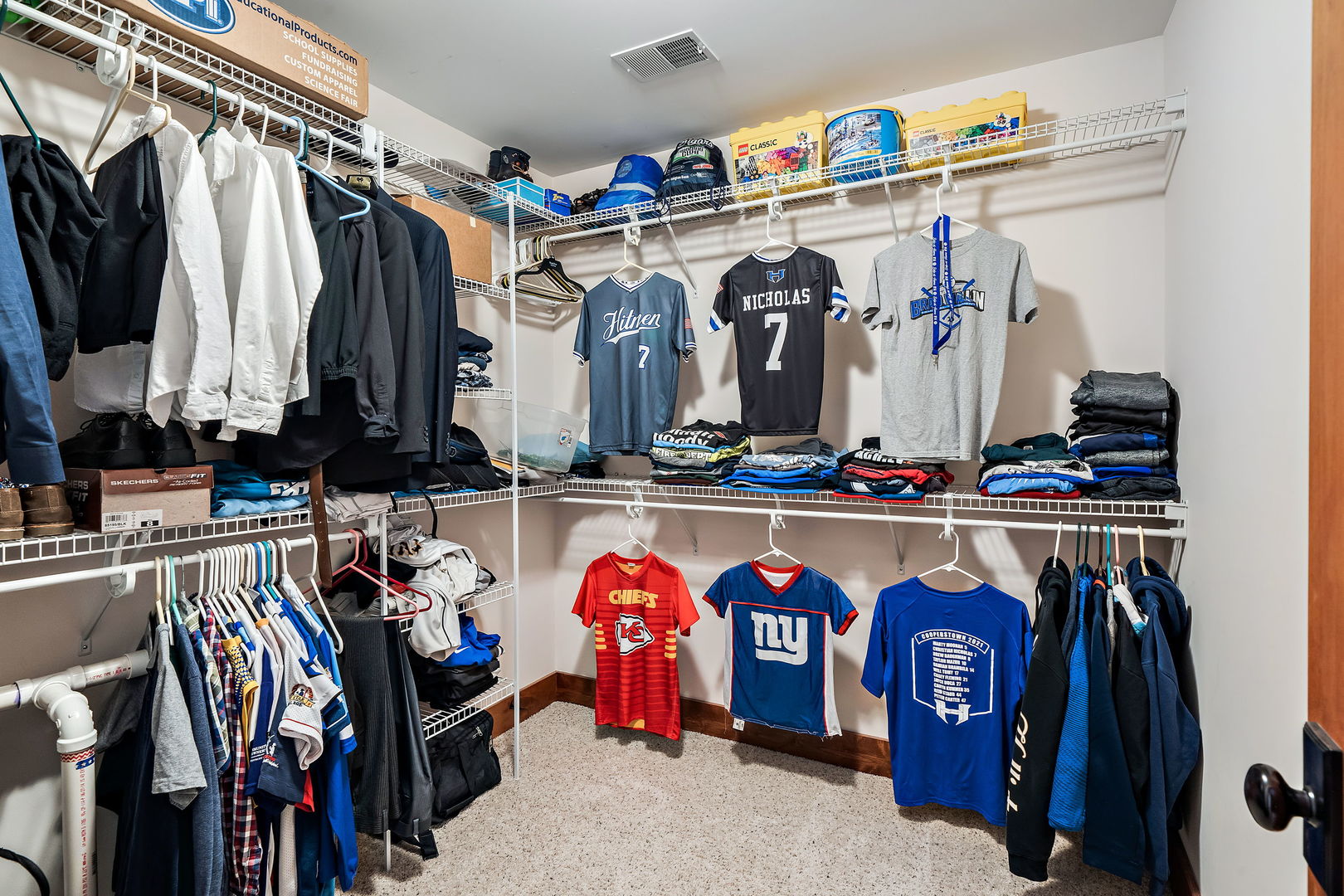 4511 Cumnor Road Downers Grove, IL 60515 - Photo 24 of 42 a view of walk in closet with clothes and shoes