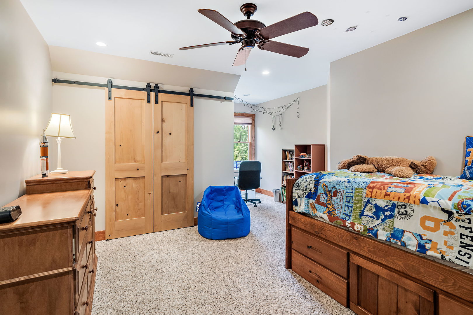 4511 Cumnor Road Downers Grove, IL 60515 - Photo 27 of 42 a bedroom with a bed and a chandelier