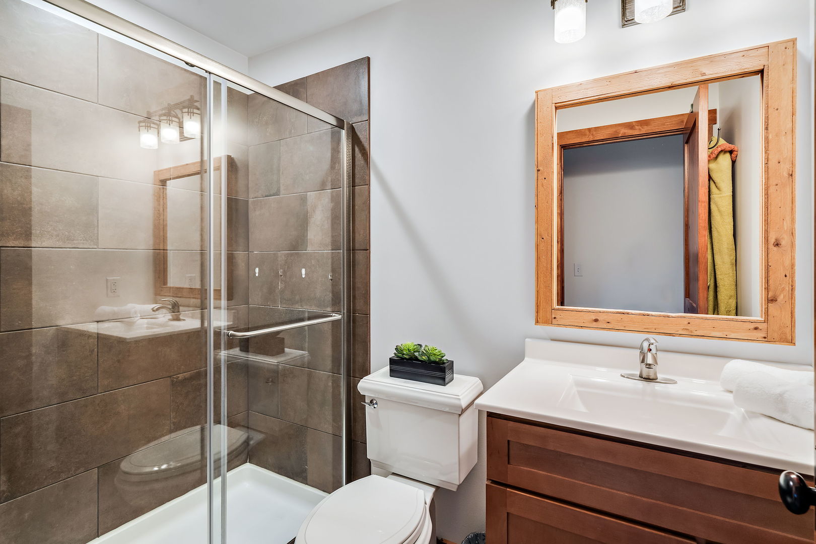 4511 Cumnor Road Downers Grove, IL 60515 - Photo 28 of 42 a bathroom with a granite countertop sink toilet a mirror and shower