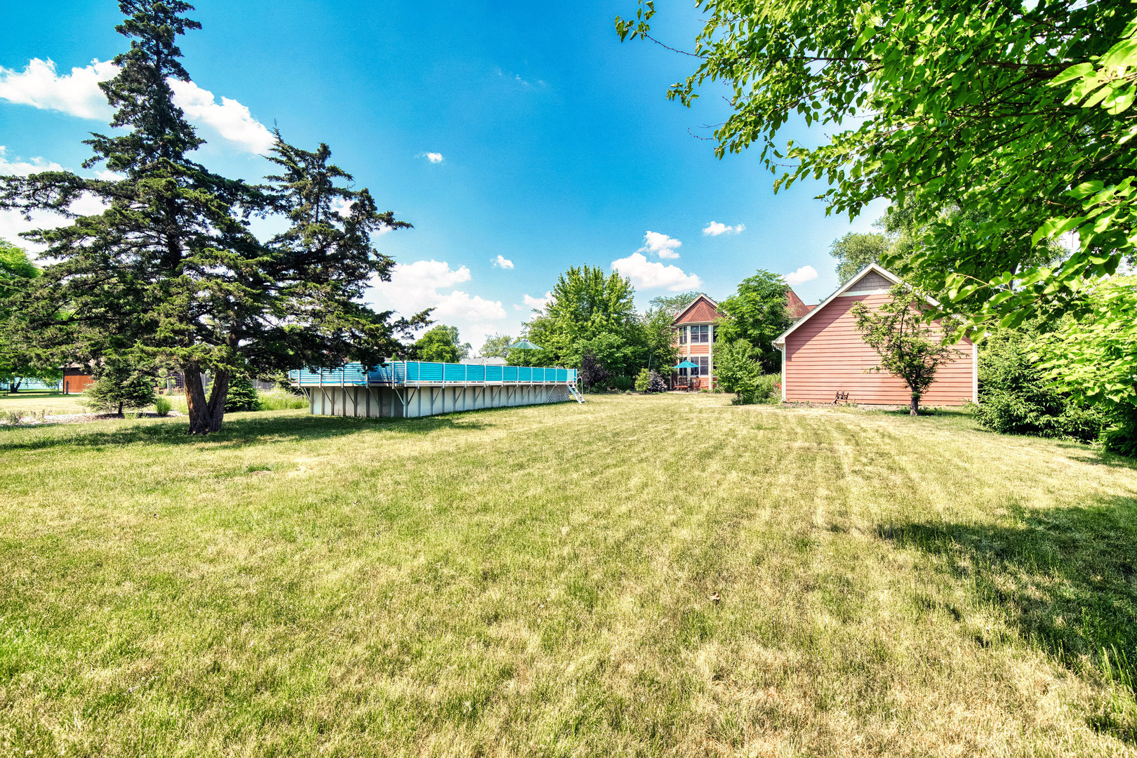 4511 Cumnor Road Downers Grove, IL 60515 - Photo 42 of 42 a view of swimming pool with an outdoor space and seating area
