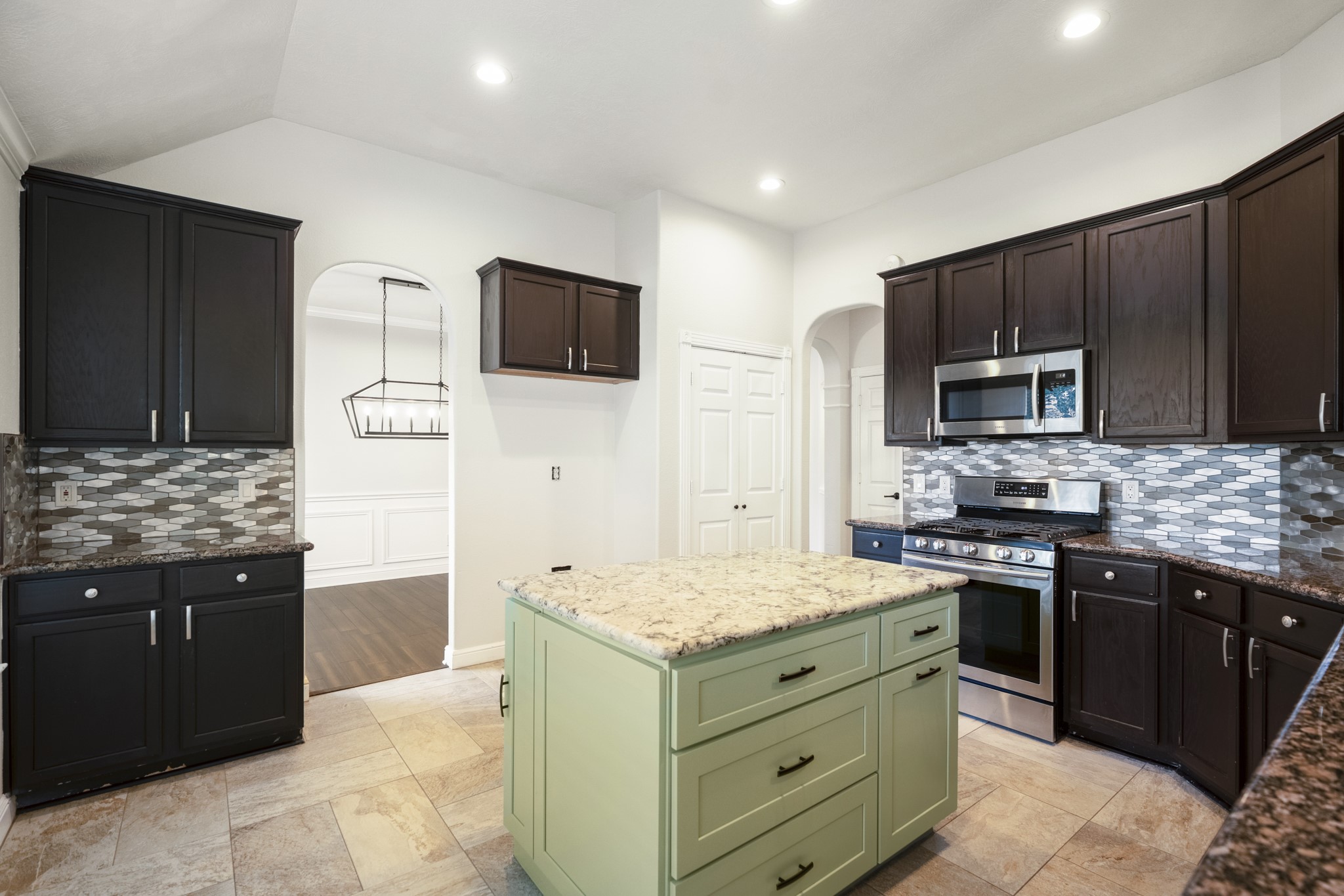 5802 Sawyer Bend Lane Spring, TX 77379 - Photo 13 of 50 a kitchen with a stove and a microwave