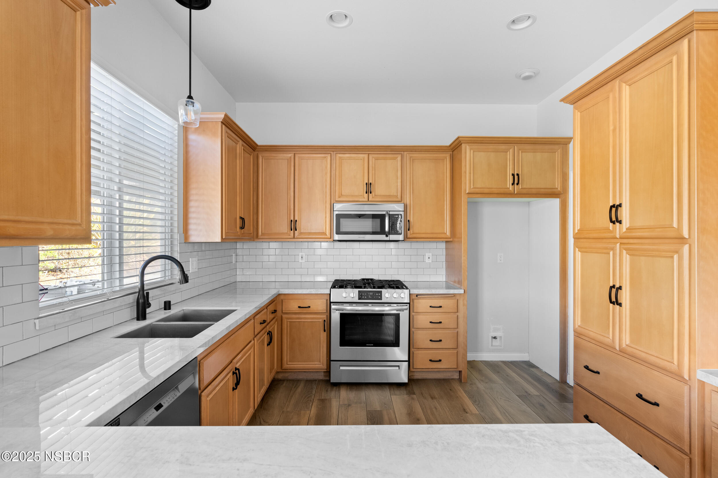608 Celestial Way Lompoc, CA 93436 - Photo 11 of 40 a kitchen with stainless steel appliances granite countertop a sink stove and refrigerator