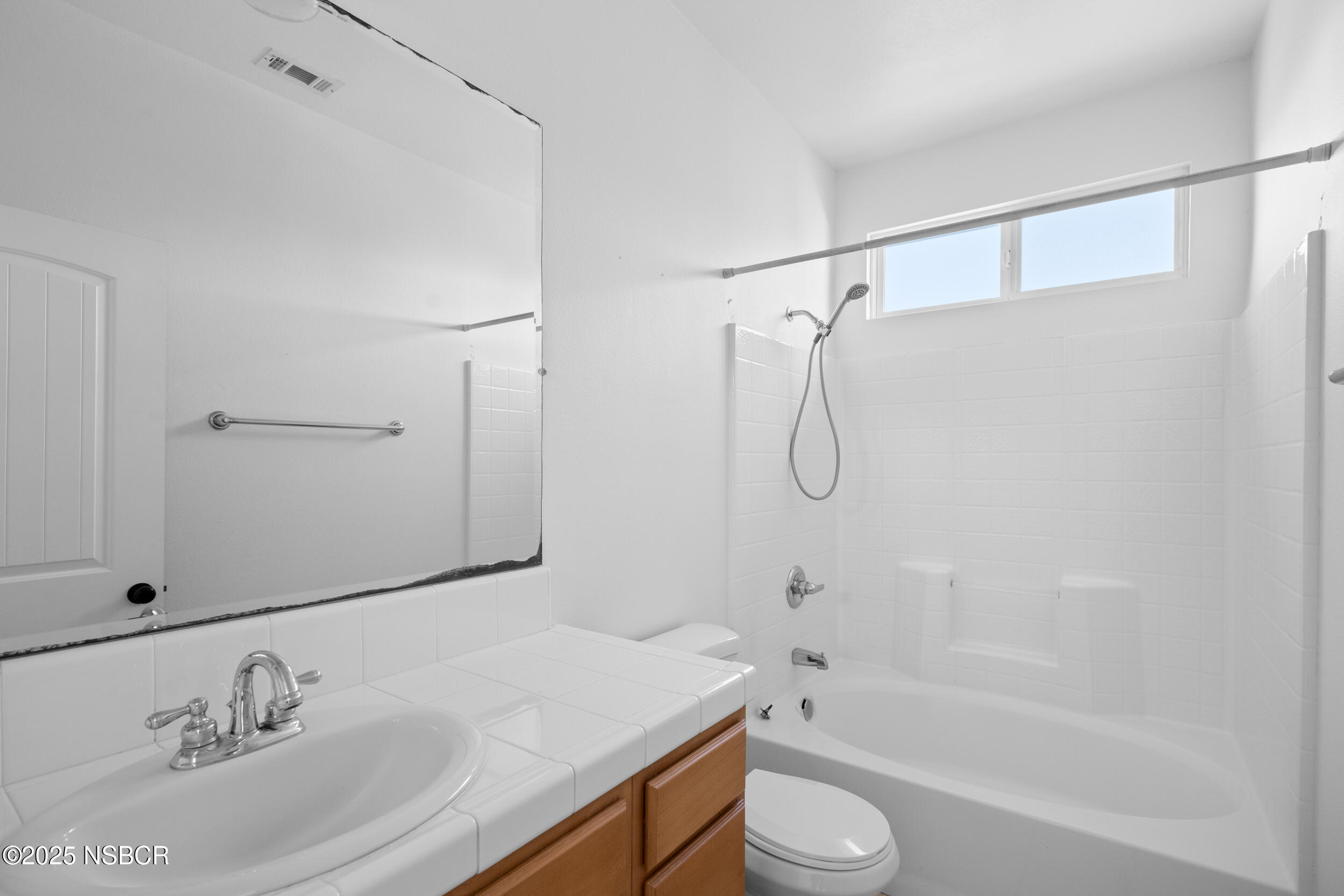 608 Celestial Way Lompoc, CA 93436 - Photo 20 of 40 a bathroom with a granite countertop sink a toilet and shower