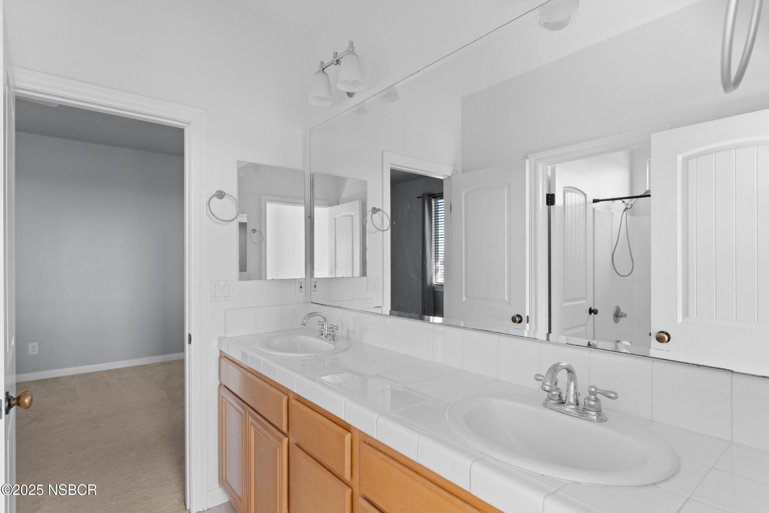608 Celestial Way Lompoc, CA 93436 - Photo 23 of 40 a bathroom with a sink double vanity and a mirror