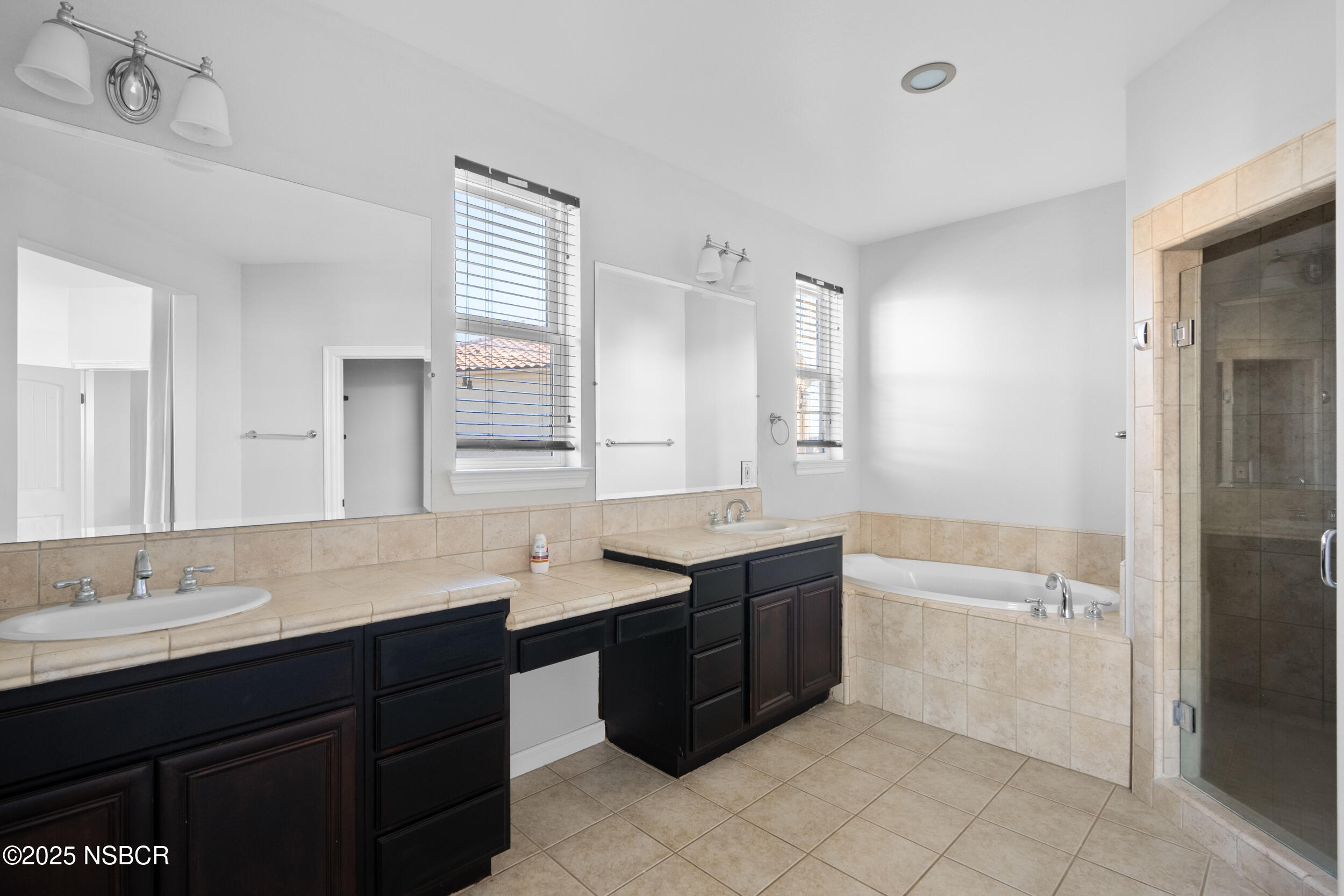 608 Celestial Way Lompoc, CA 93436 - Photo 32 of 40 a bathroom with a granite countertop bathtub sink double and mirror